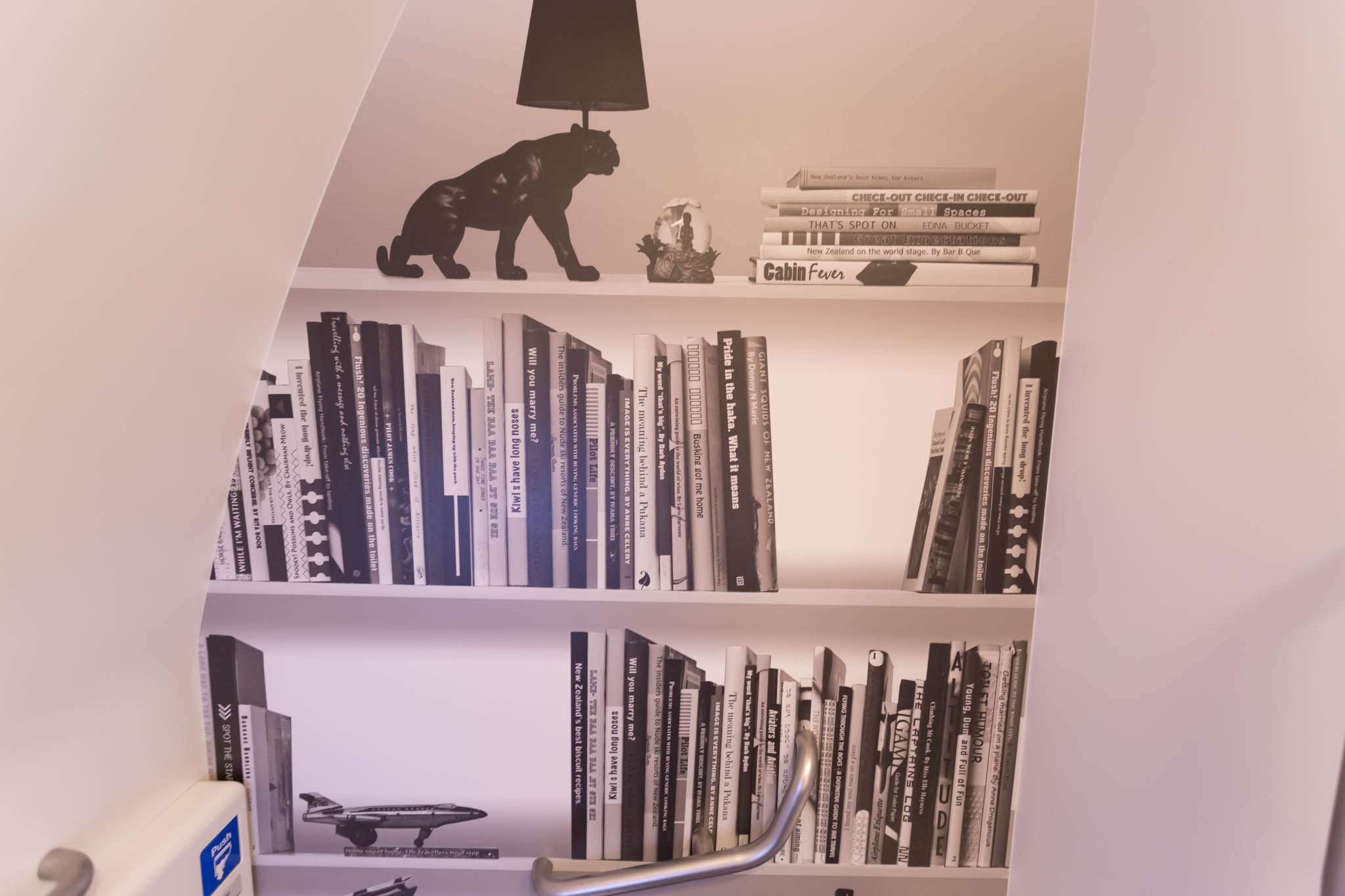 a staircase with a book shelf