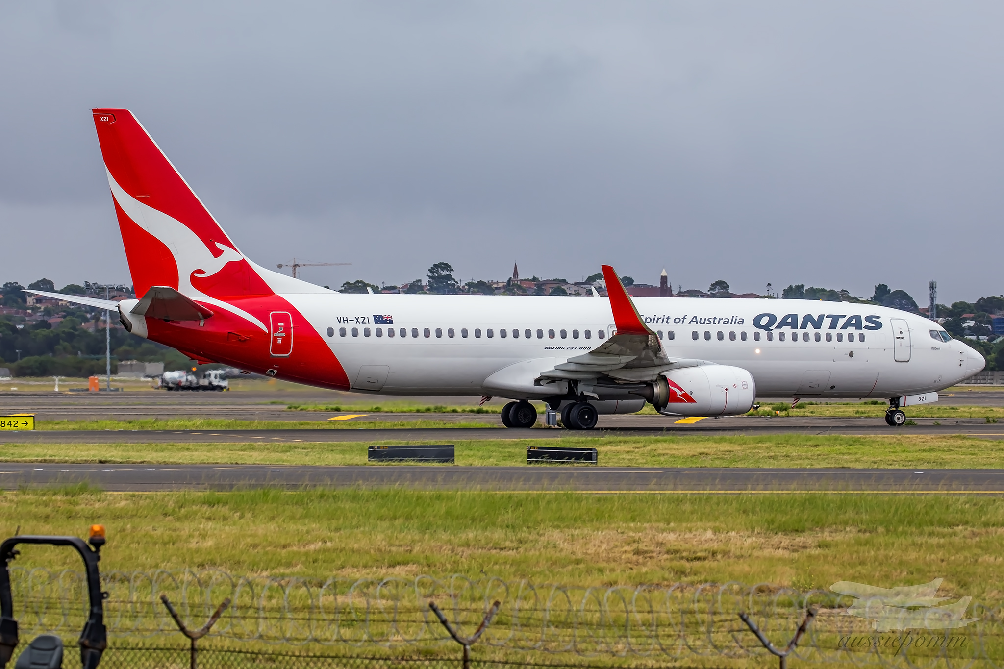 a white and red airplane on a runway