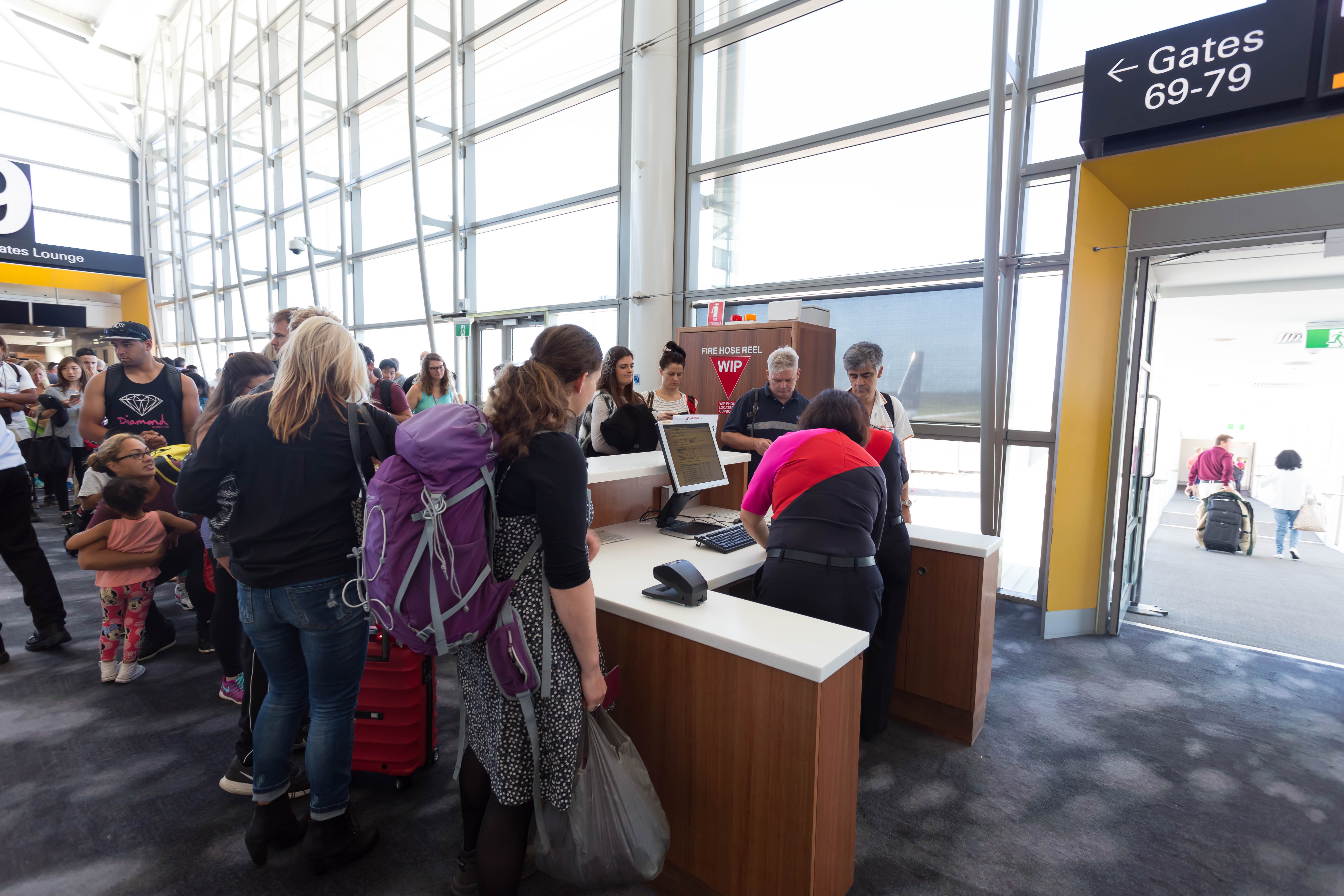 a group of people standing around a counter