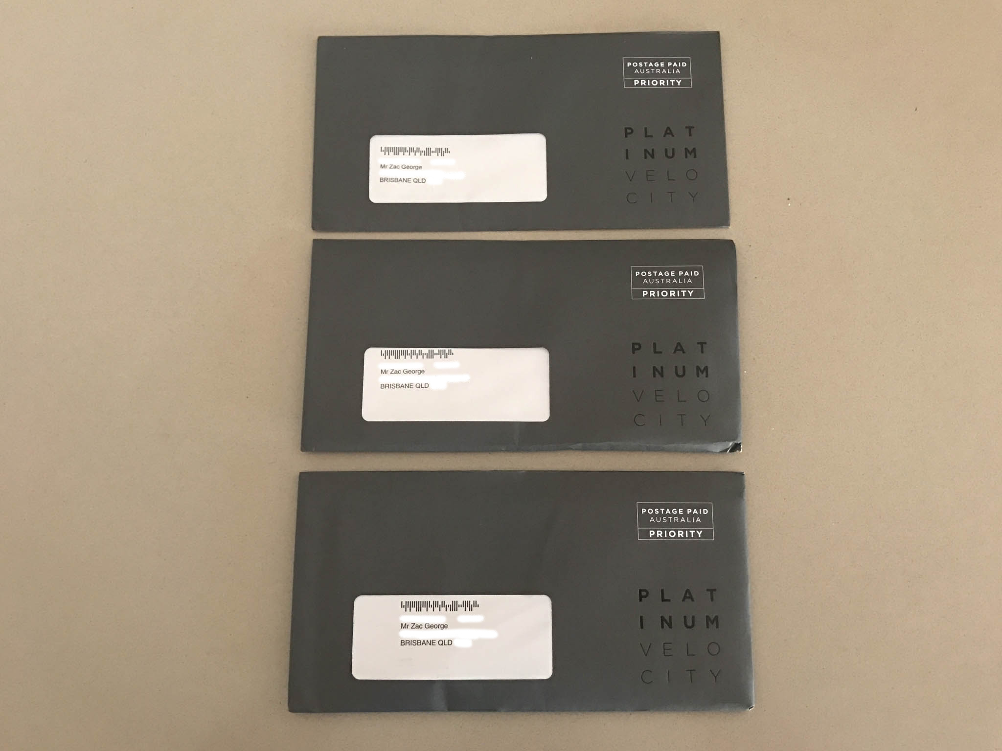 a group of envelopes with white labels