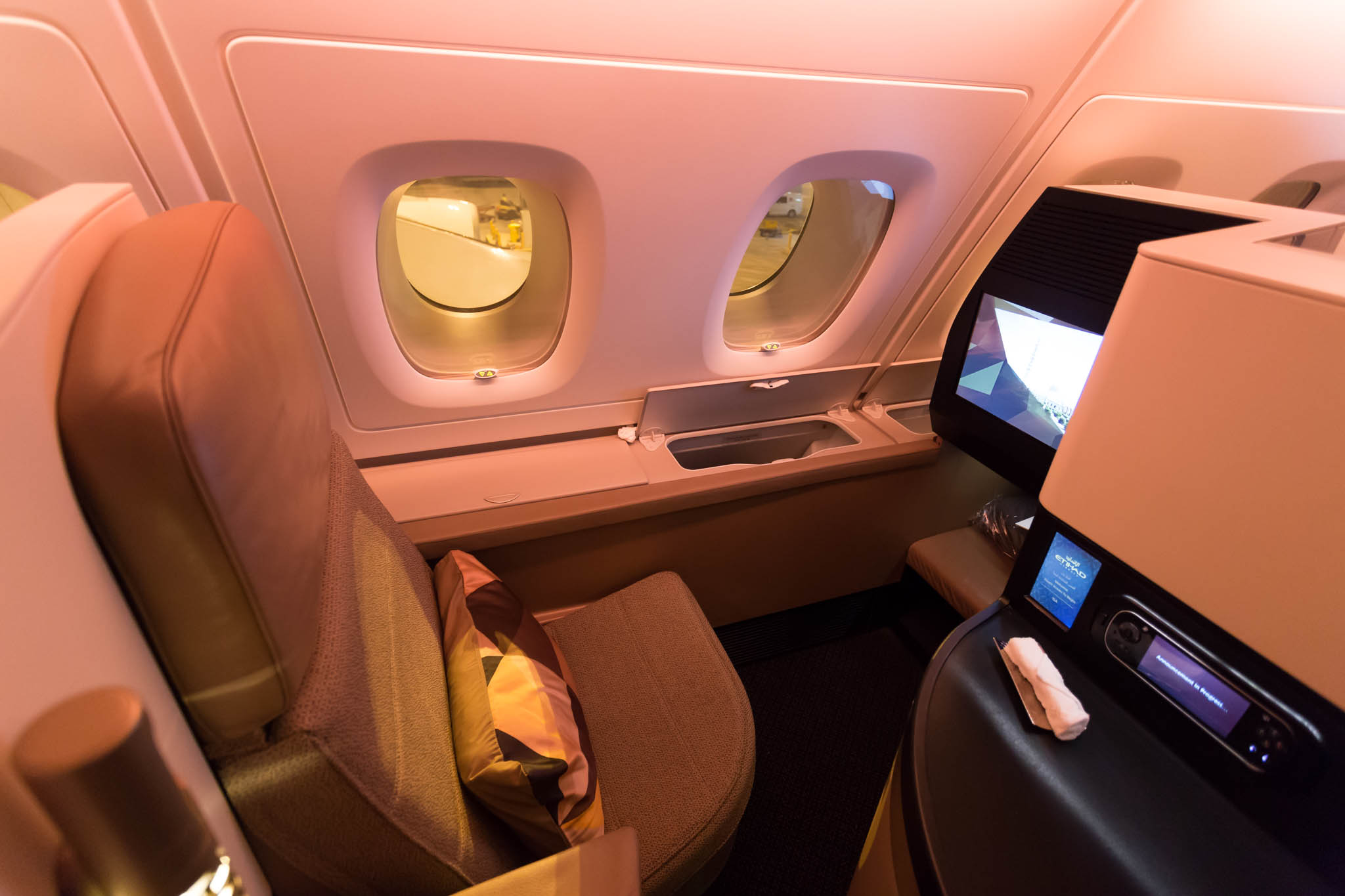 a seat and window in an airplane