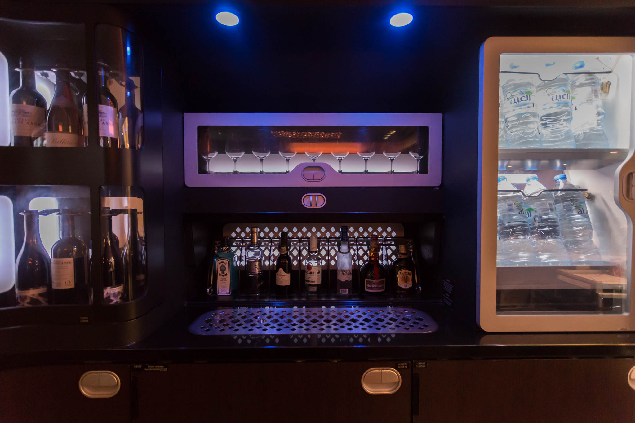 a bar with bottles of liquor and glasses