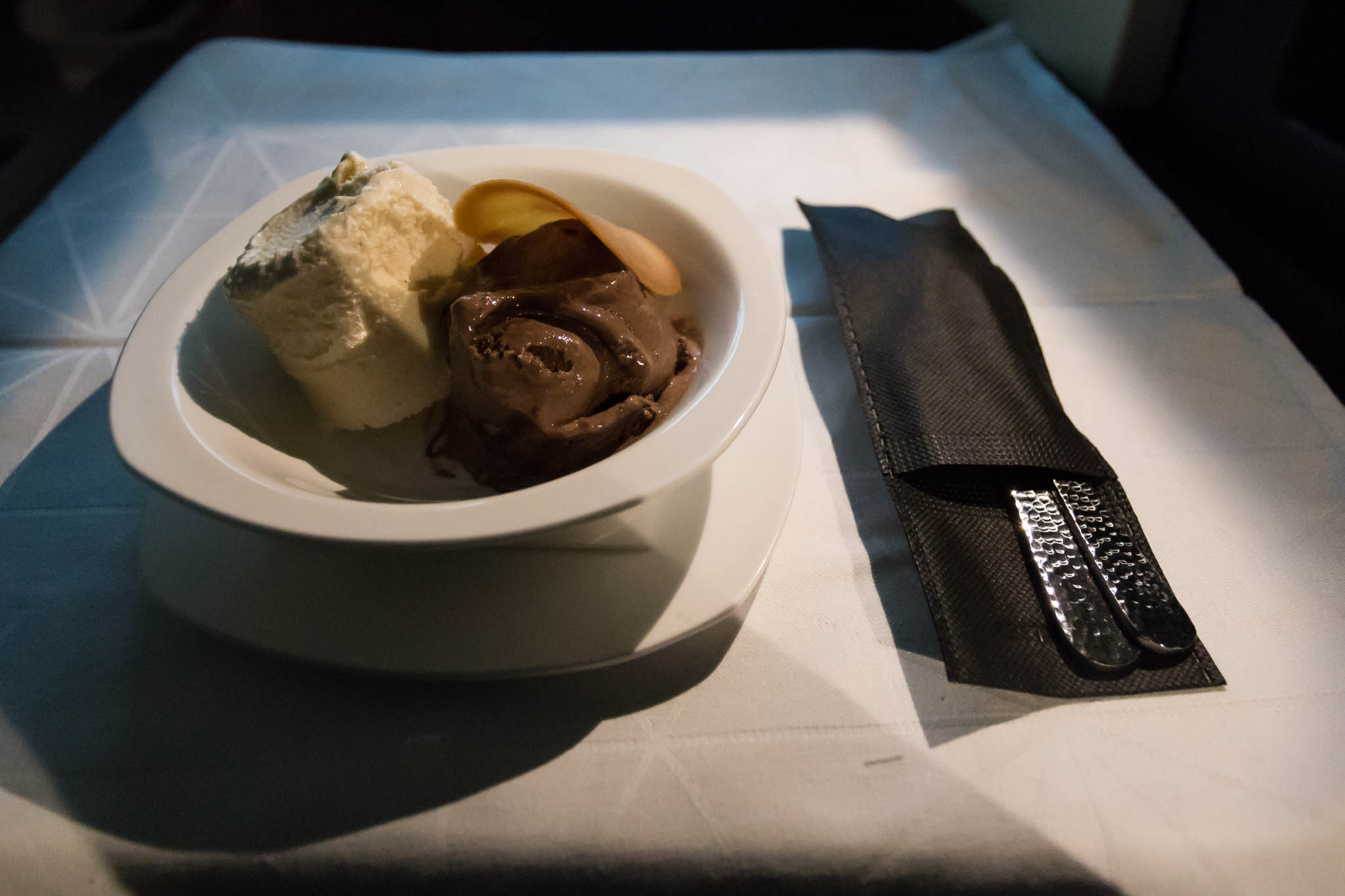 a bowl of ice cream and a knife