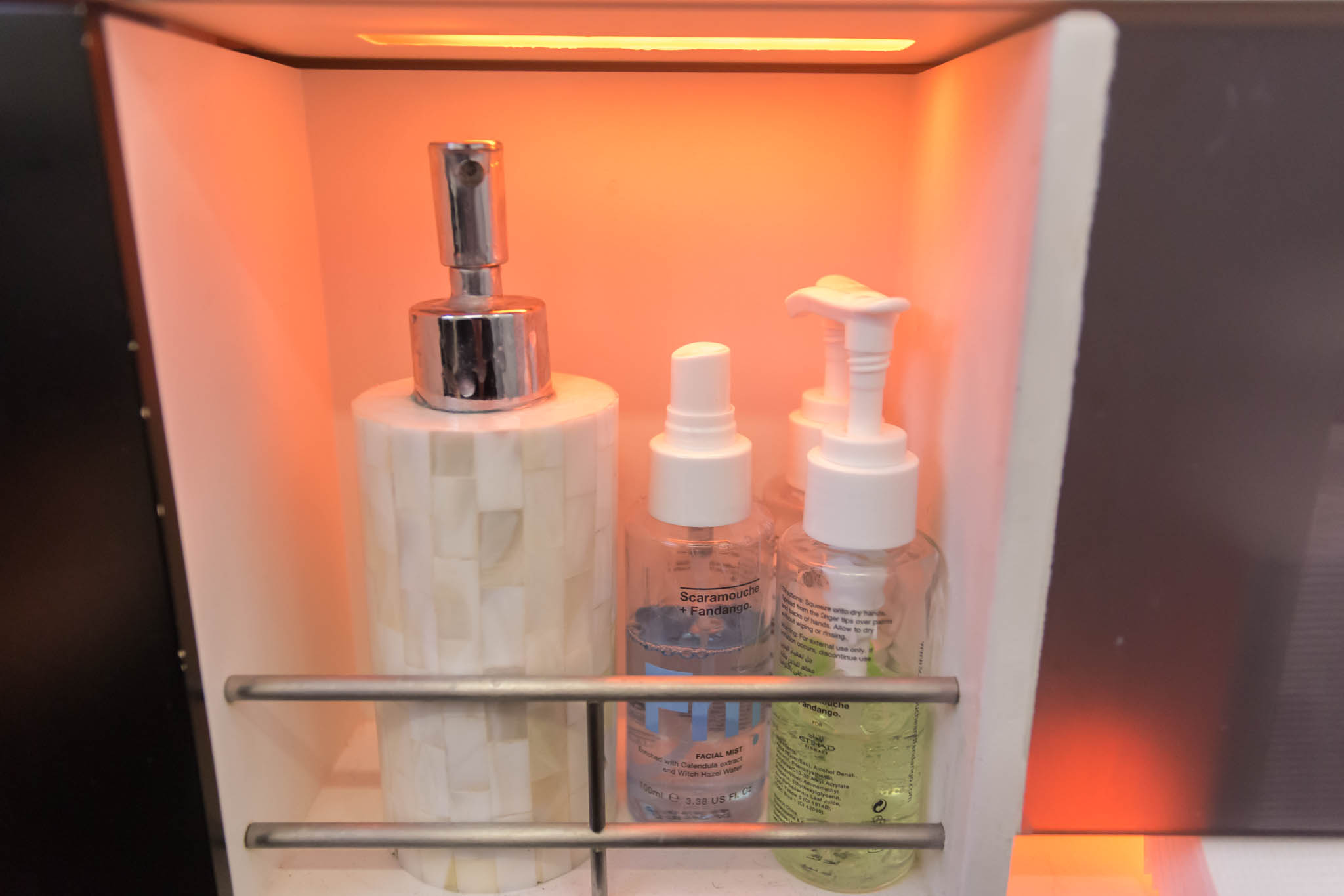a group of bottles in a shelf