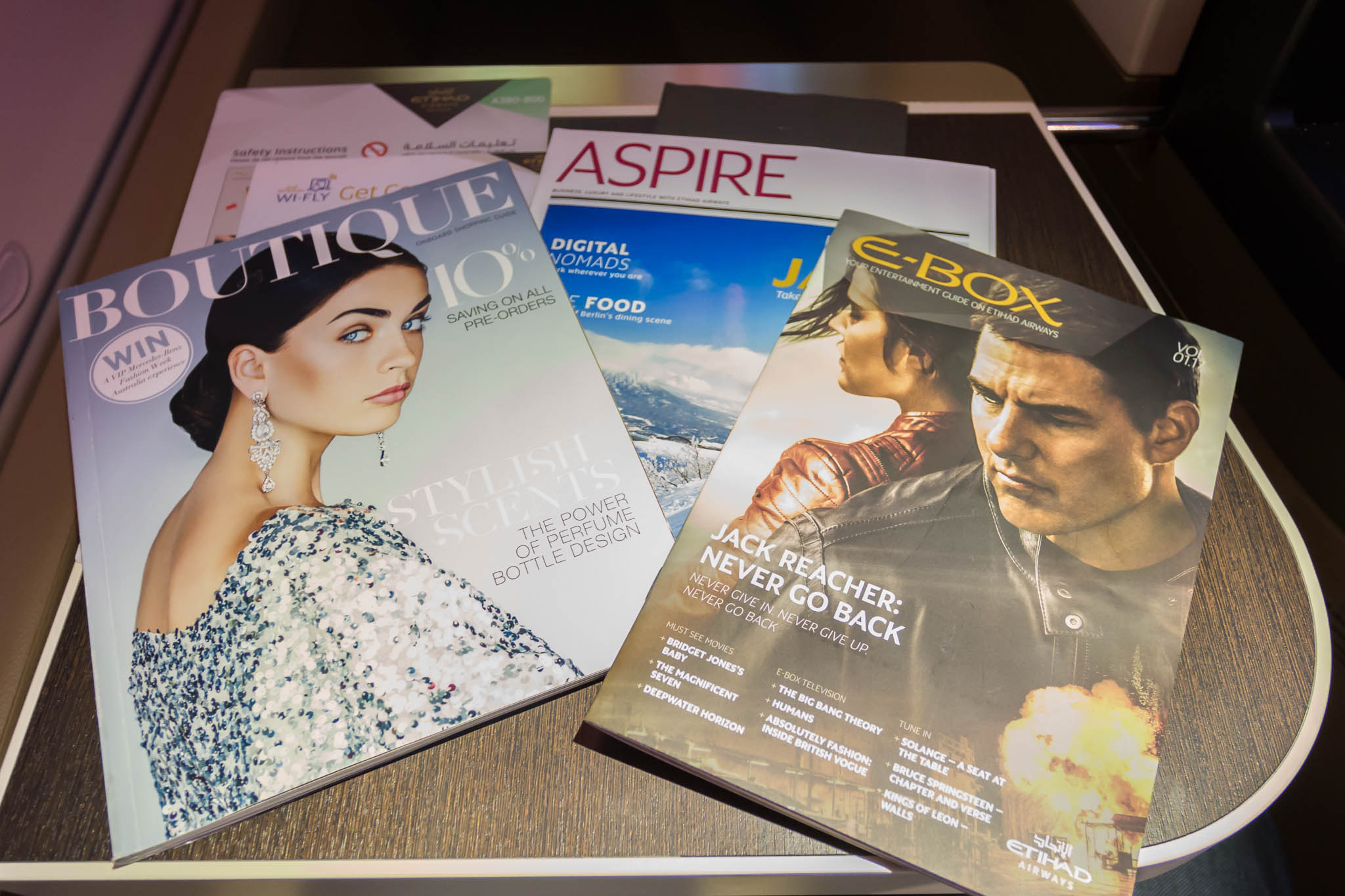 a group of magazines on a table