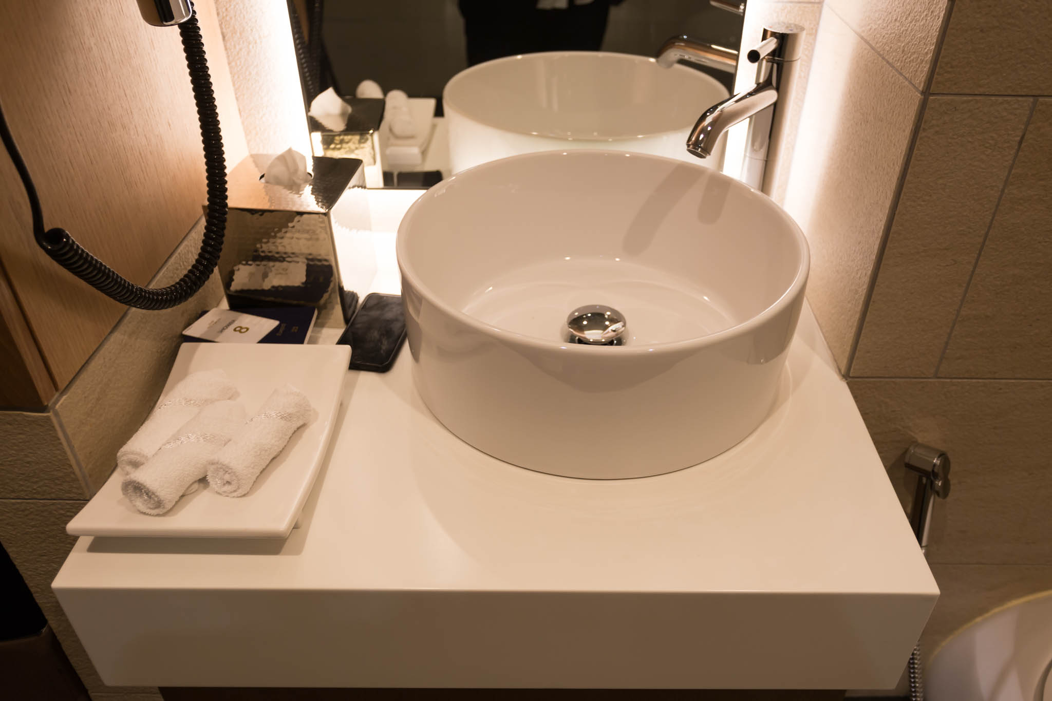 a sink and faucet in a bathroom