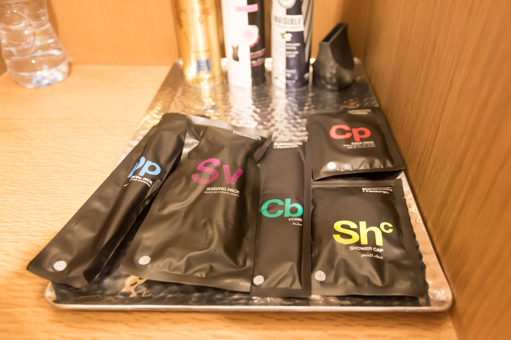 a group of black packages on a metal tray