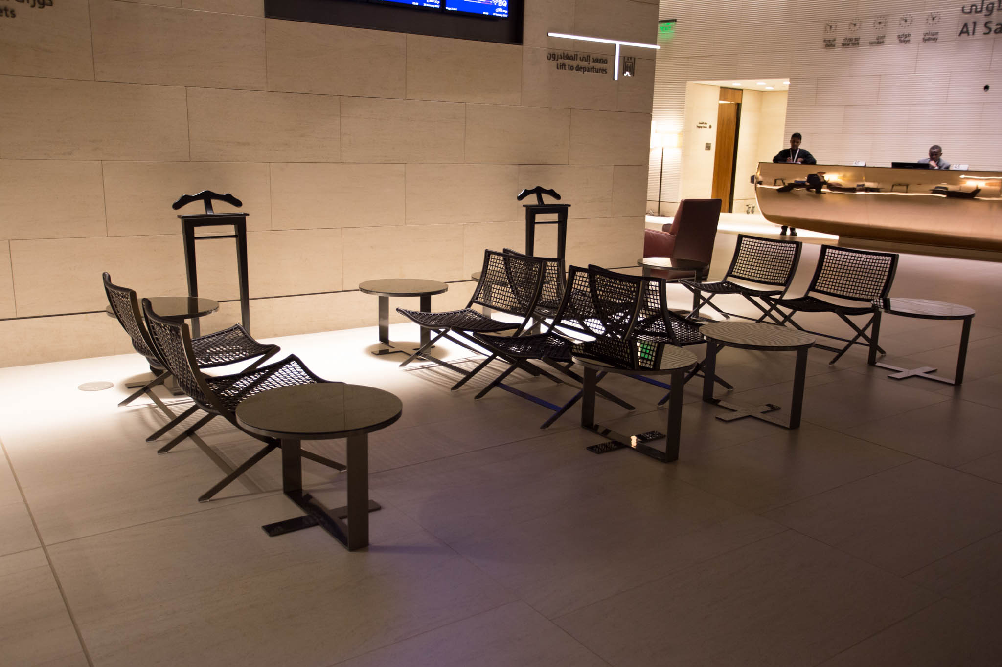 a group of chairs and tables in a room
