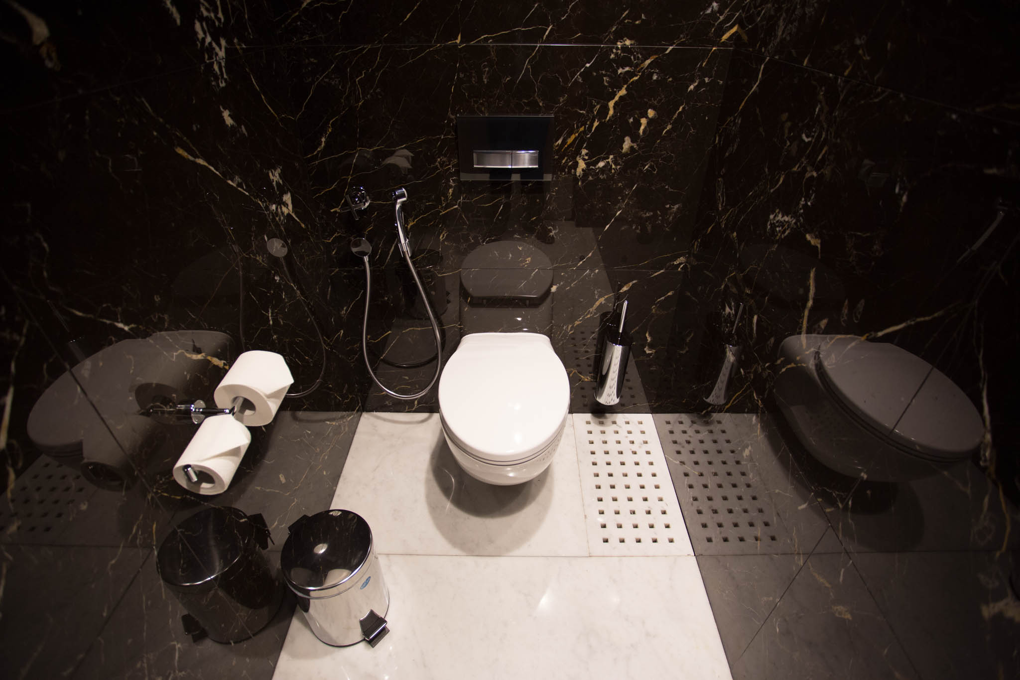 a bathroom with a toilet and toilet paper