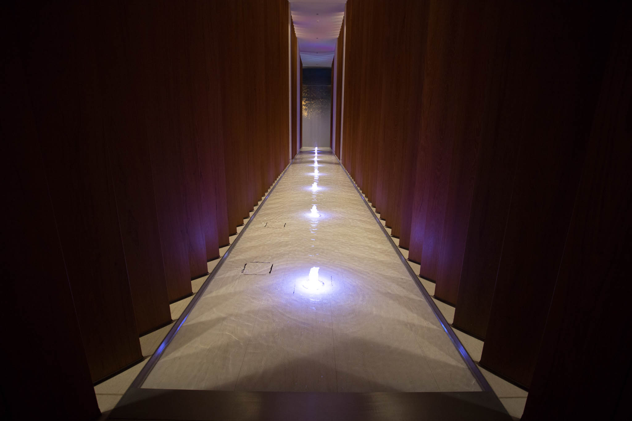 a long hallway with lights