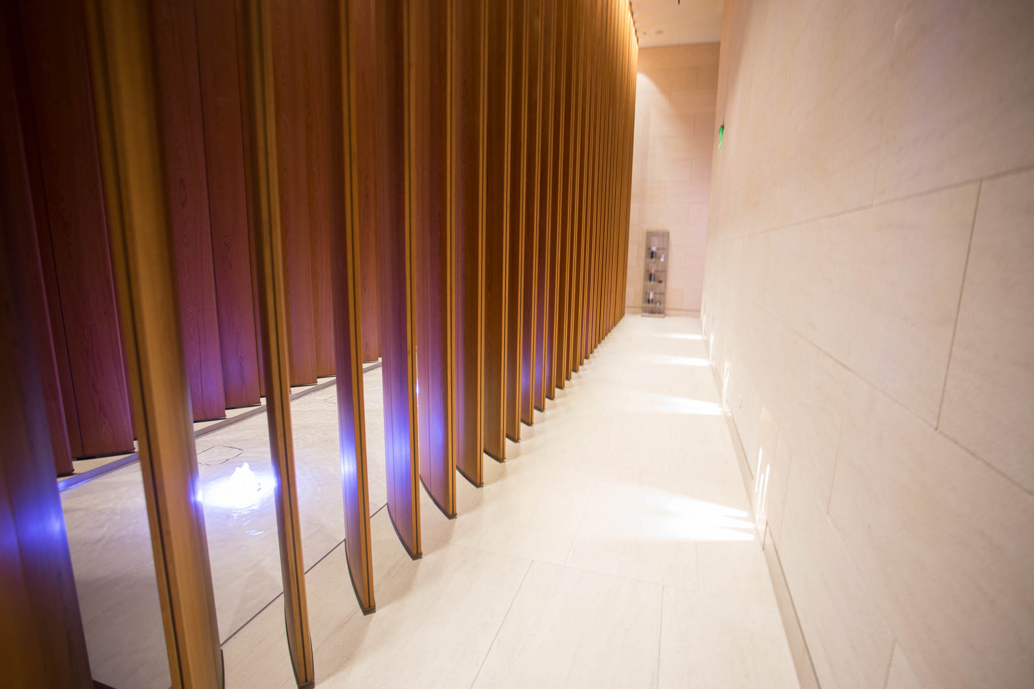 a long corridor with wood panels