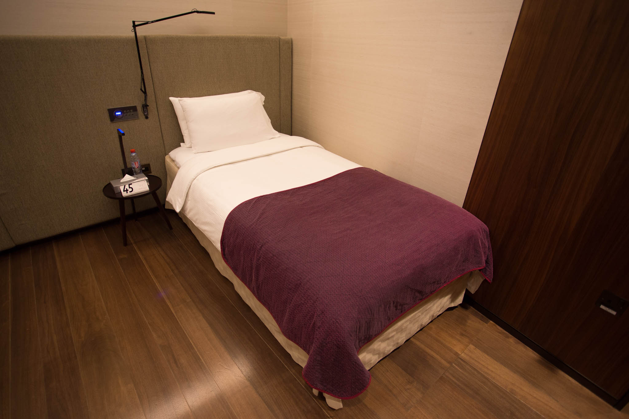 a bed with a purple blanket
