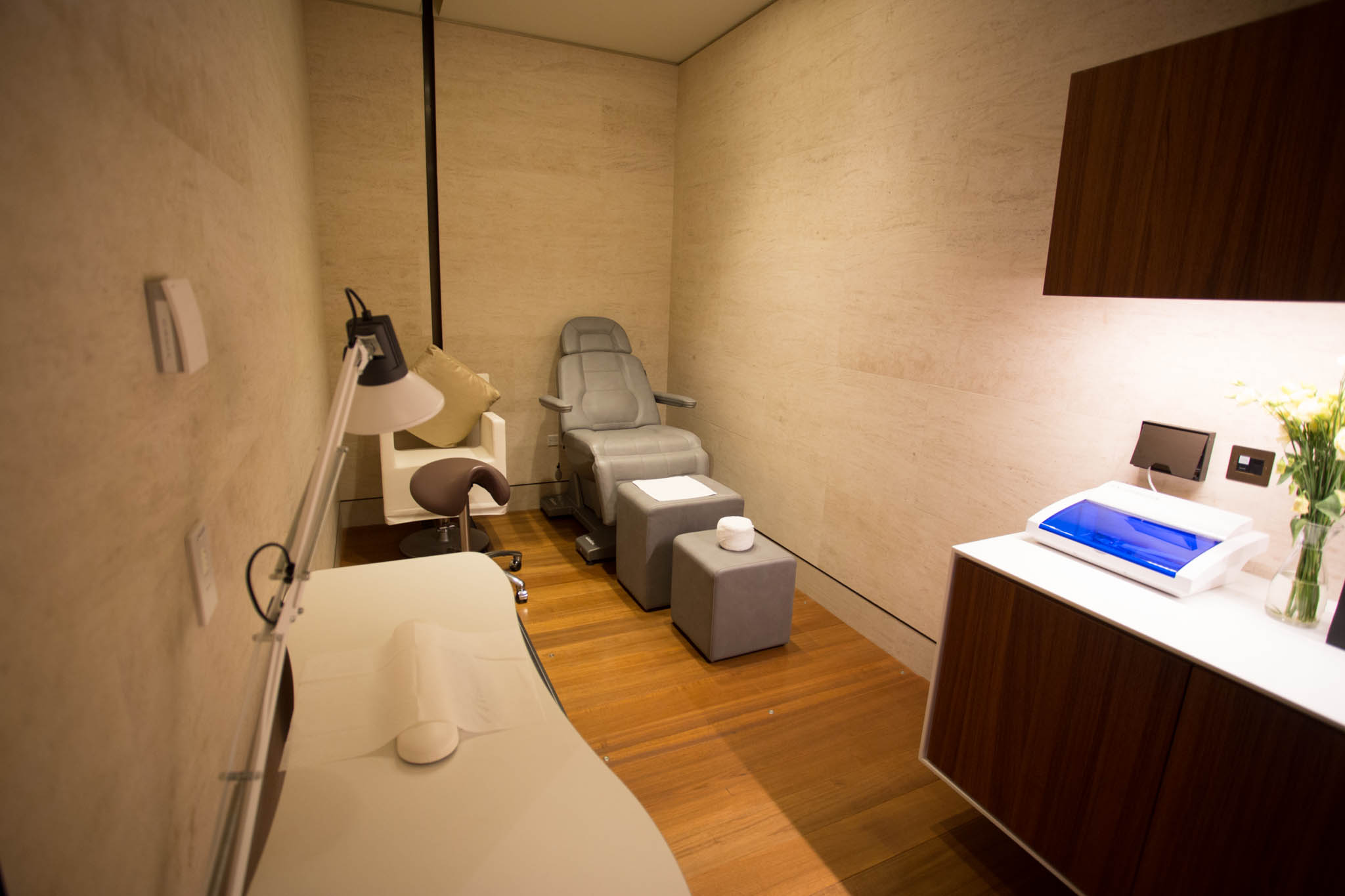 a room with a massage chair and a table