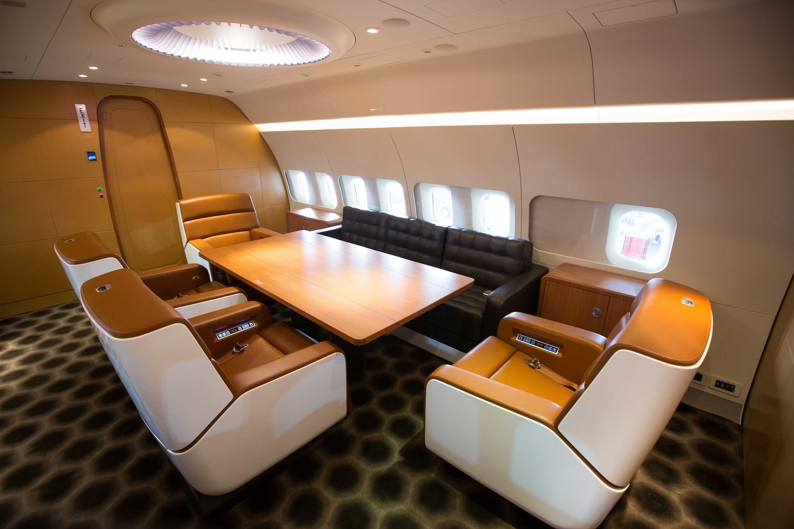 a table and chairs in a plane