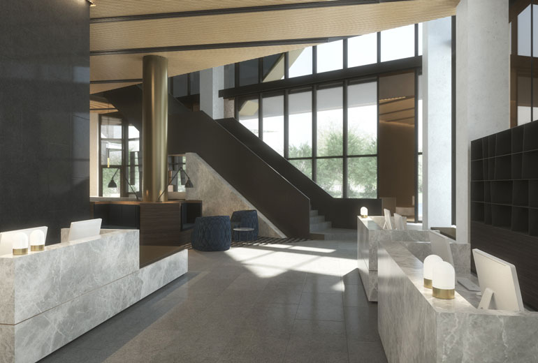 a lobby with a staircase and a large window