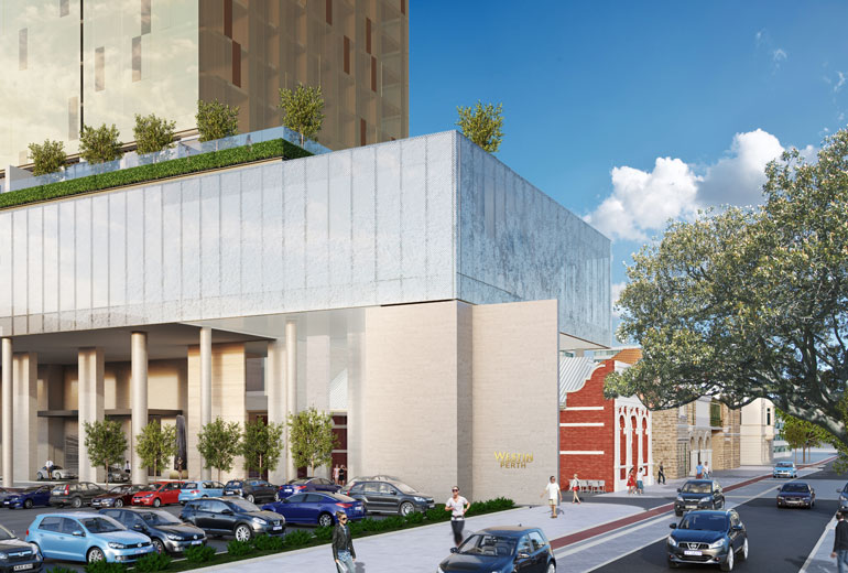 a building with trees and cars parked on the side of it