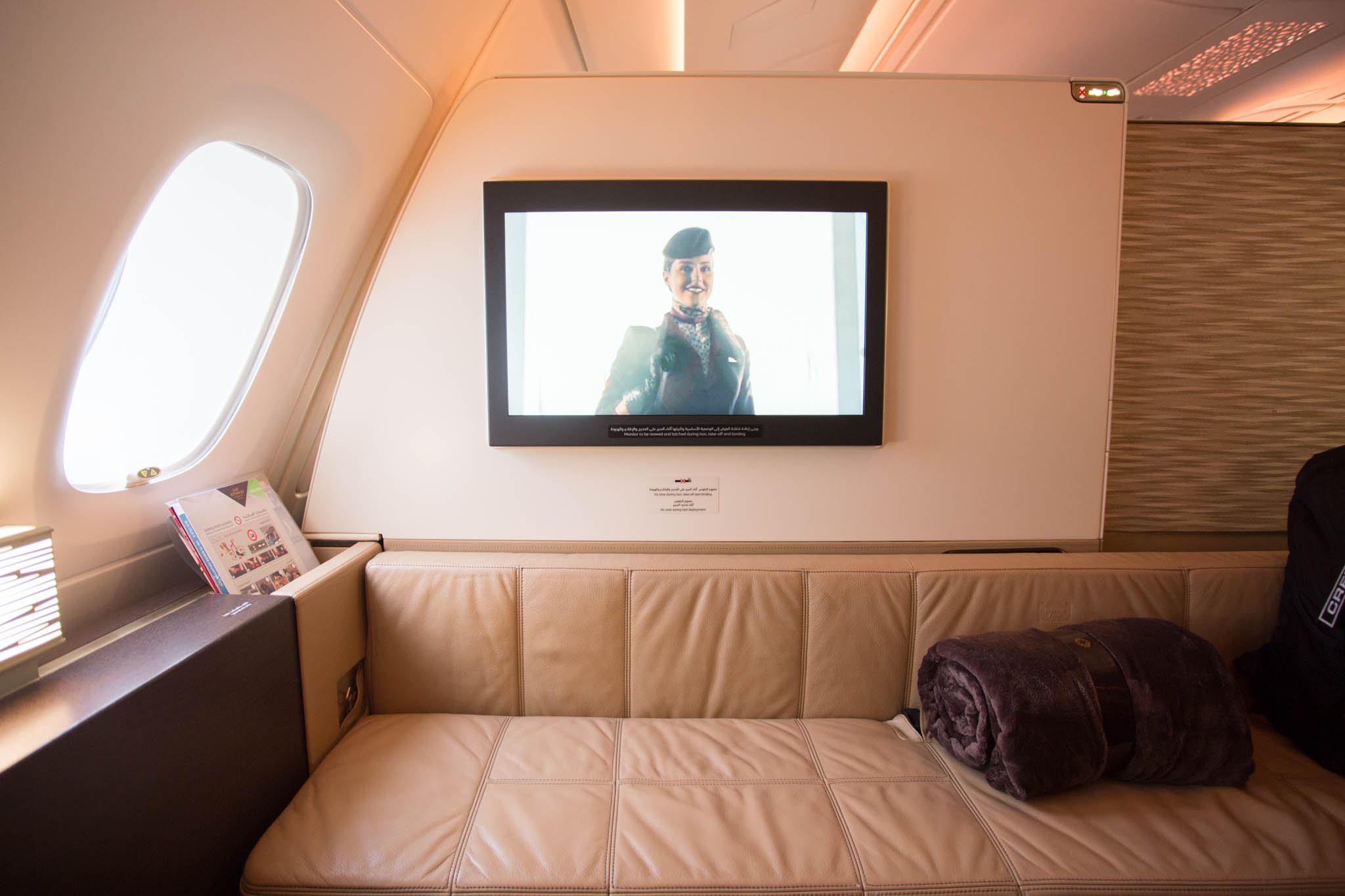 a tv on the wall of a plane