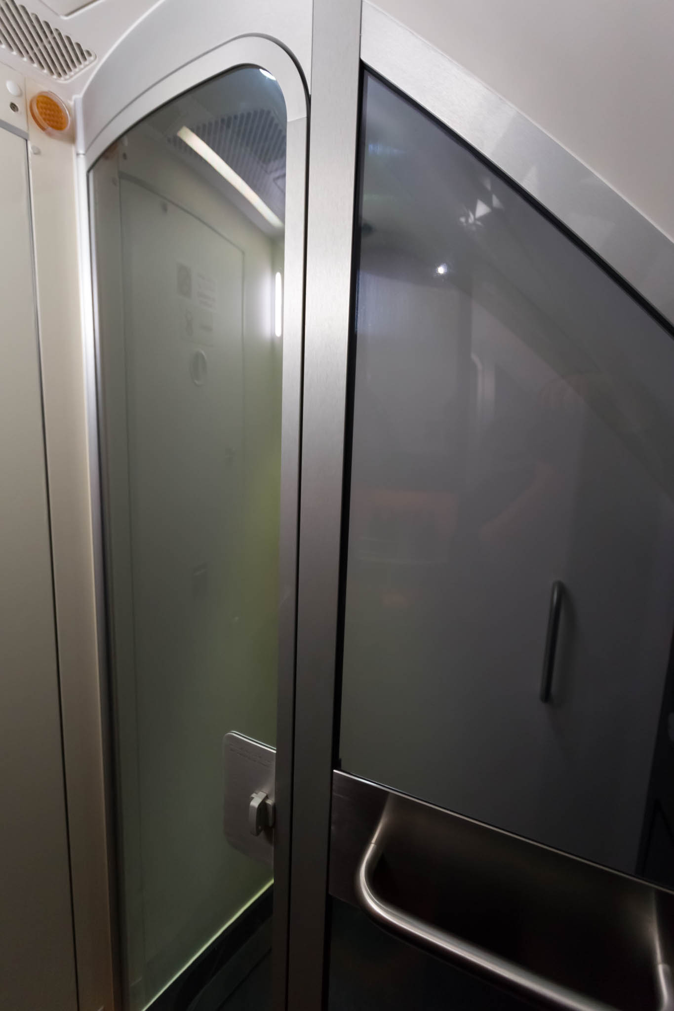 a glass door with a light on the side