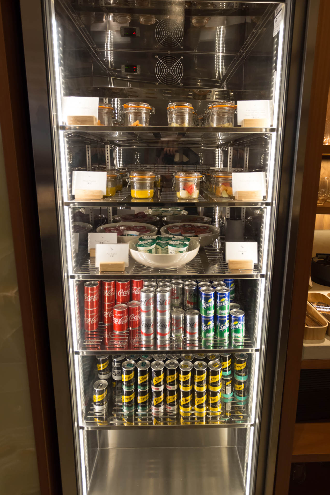 a refrigerator with cans and cans of food