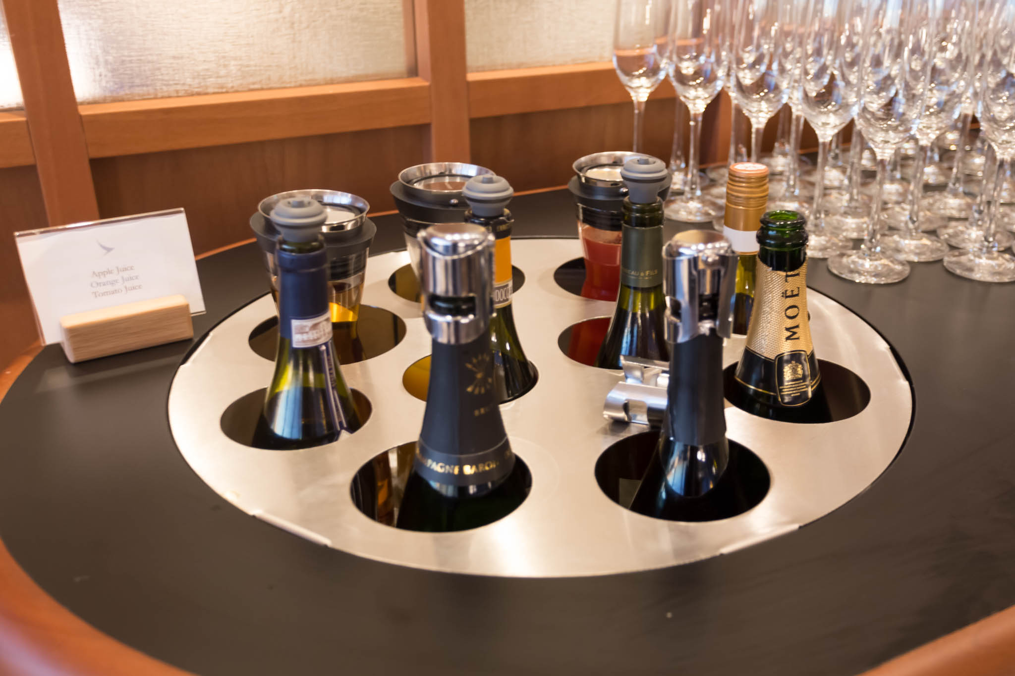 a group of wine bottles and glasses on a table