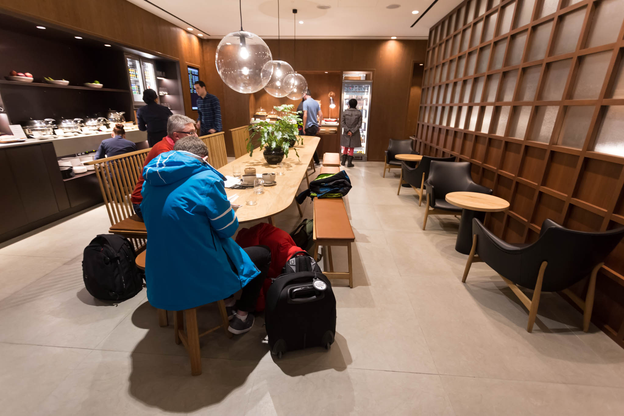 people sitting at a table in a restaurant