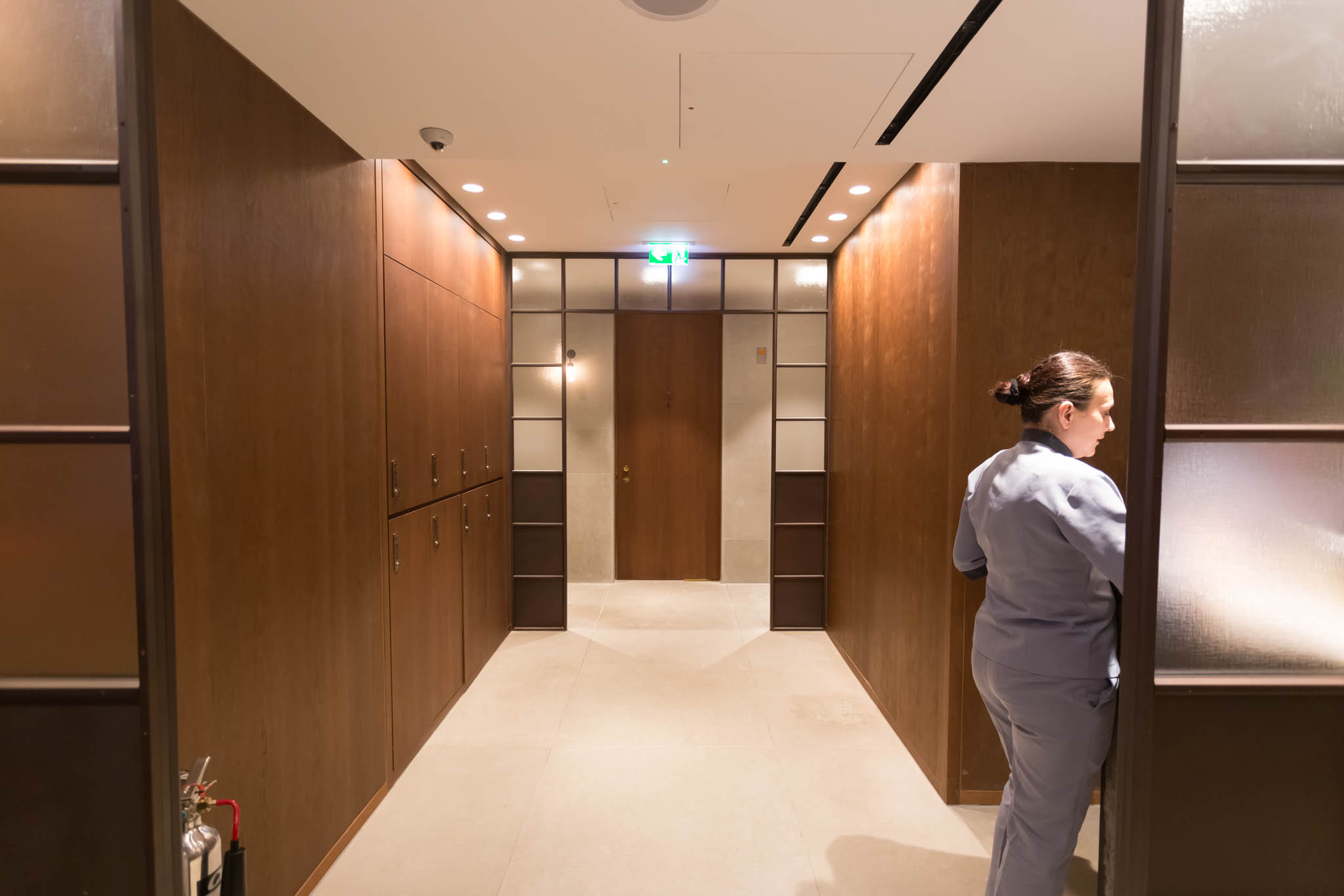 a woman standing in a hallway