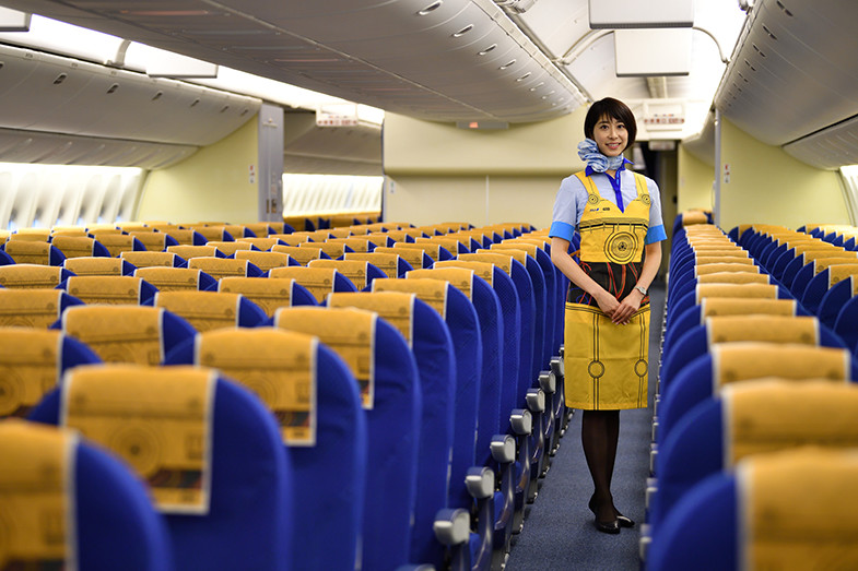 a woman standing in an airplane