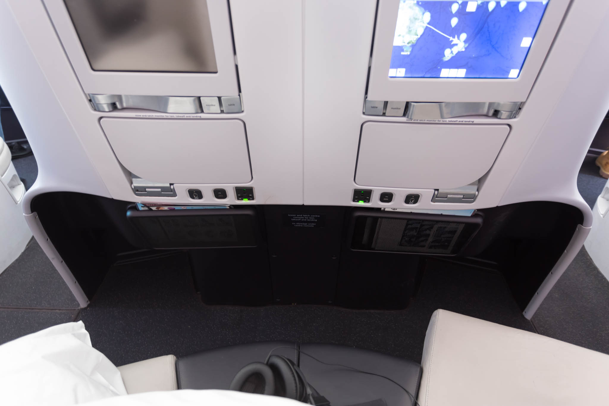 the seats and monitors in an airplane