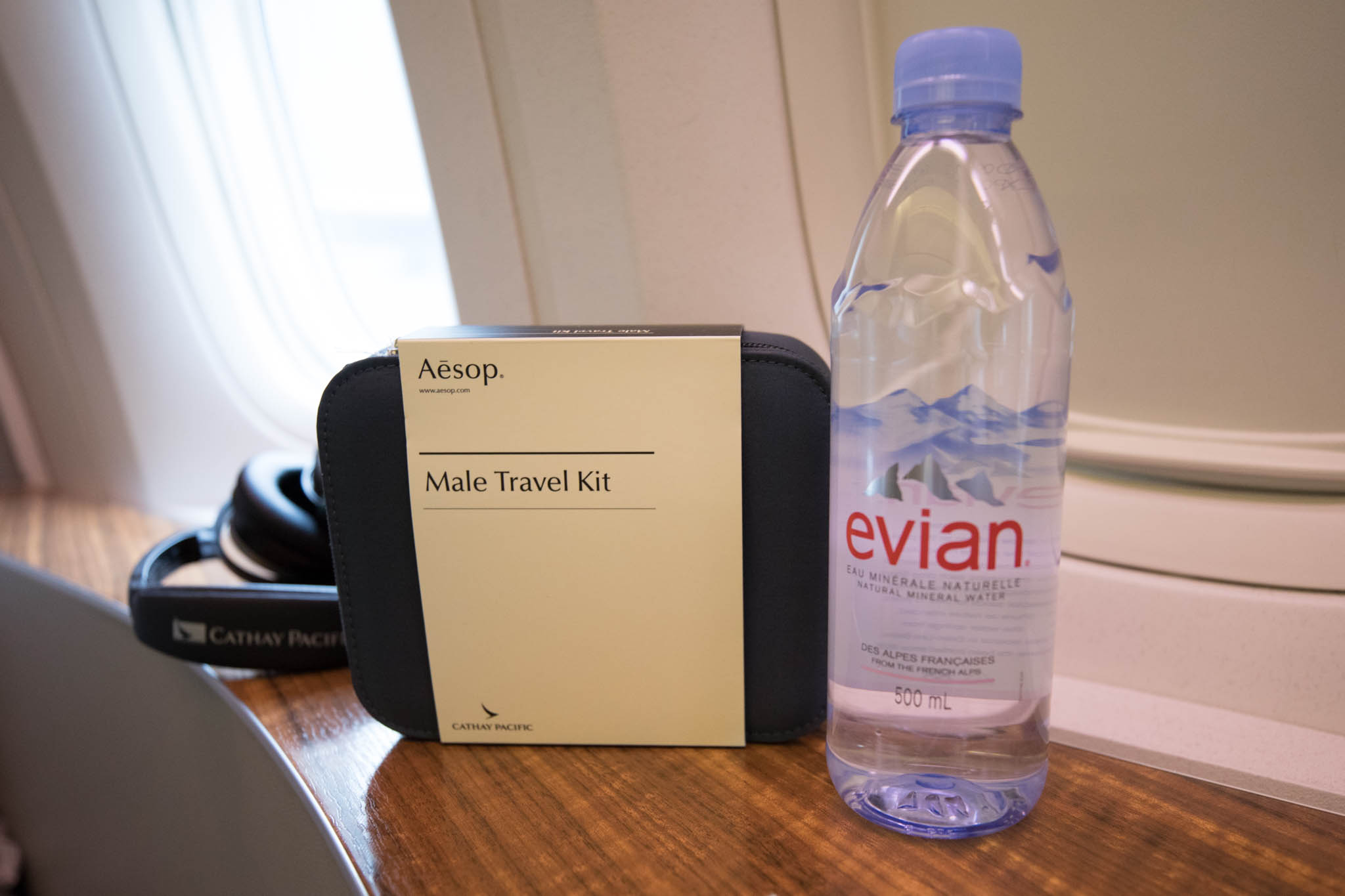 a water bottle next to a travel kit