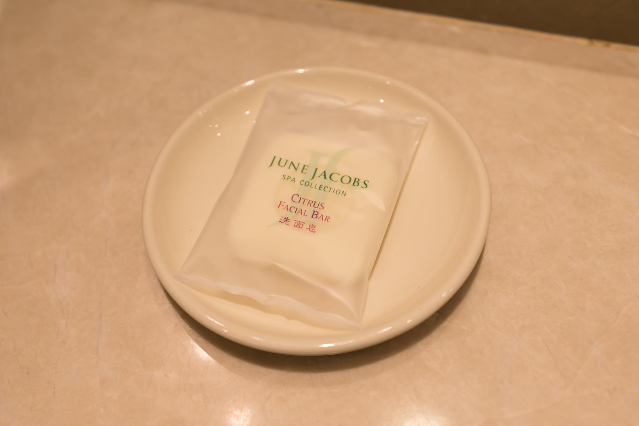 a small white package on a white plate