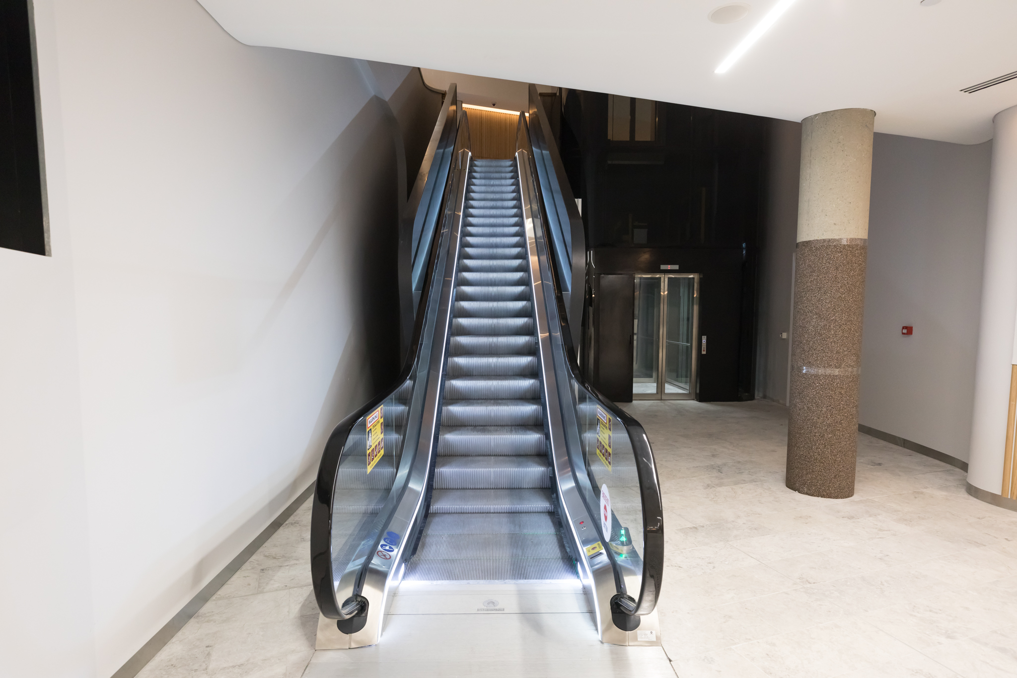 an escalator in a building