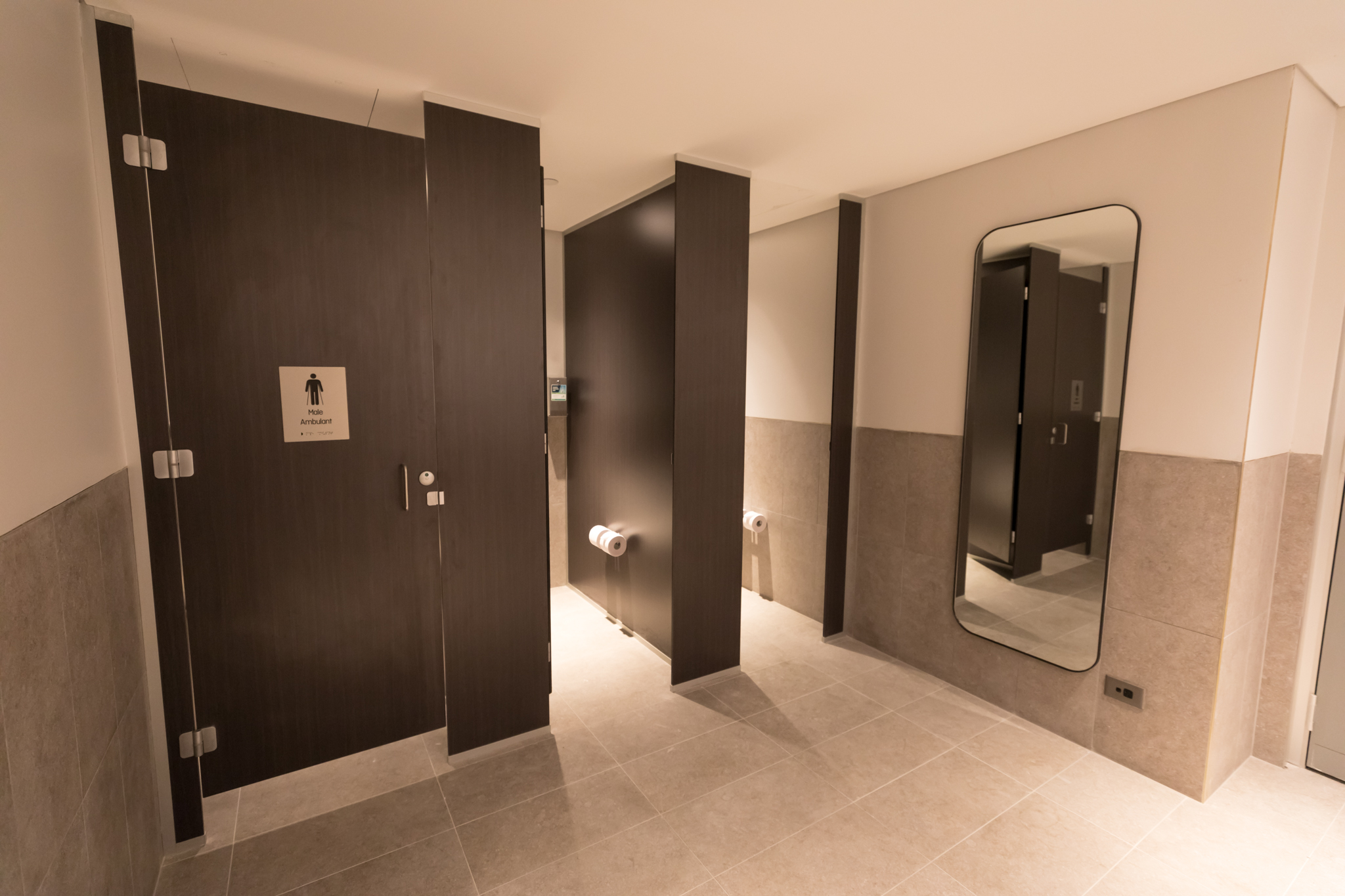 a bathroom with a mirror and doors