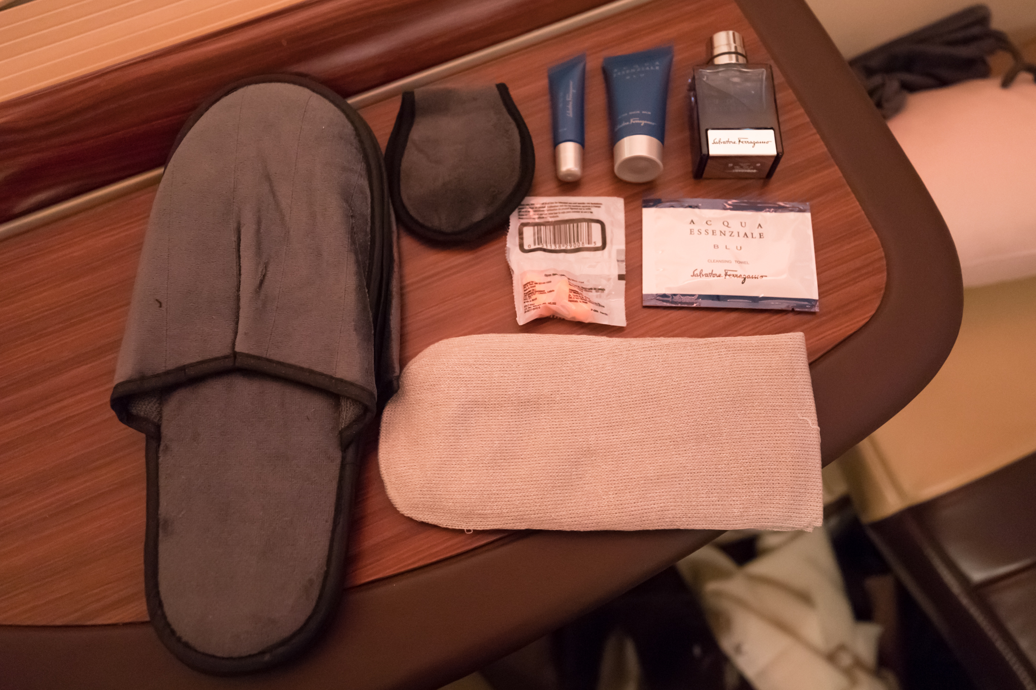a slipper and toiletries on a table