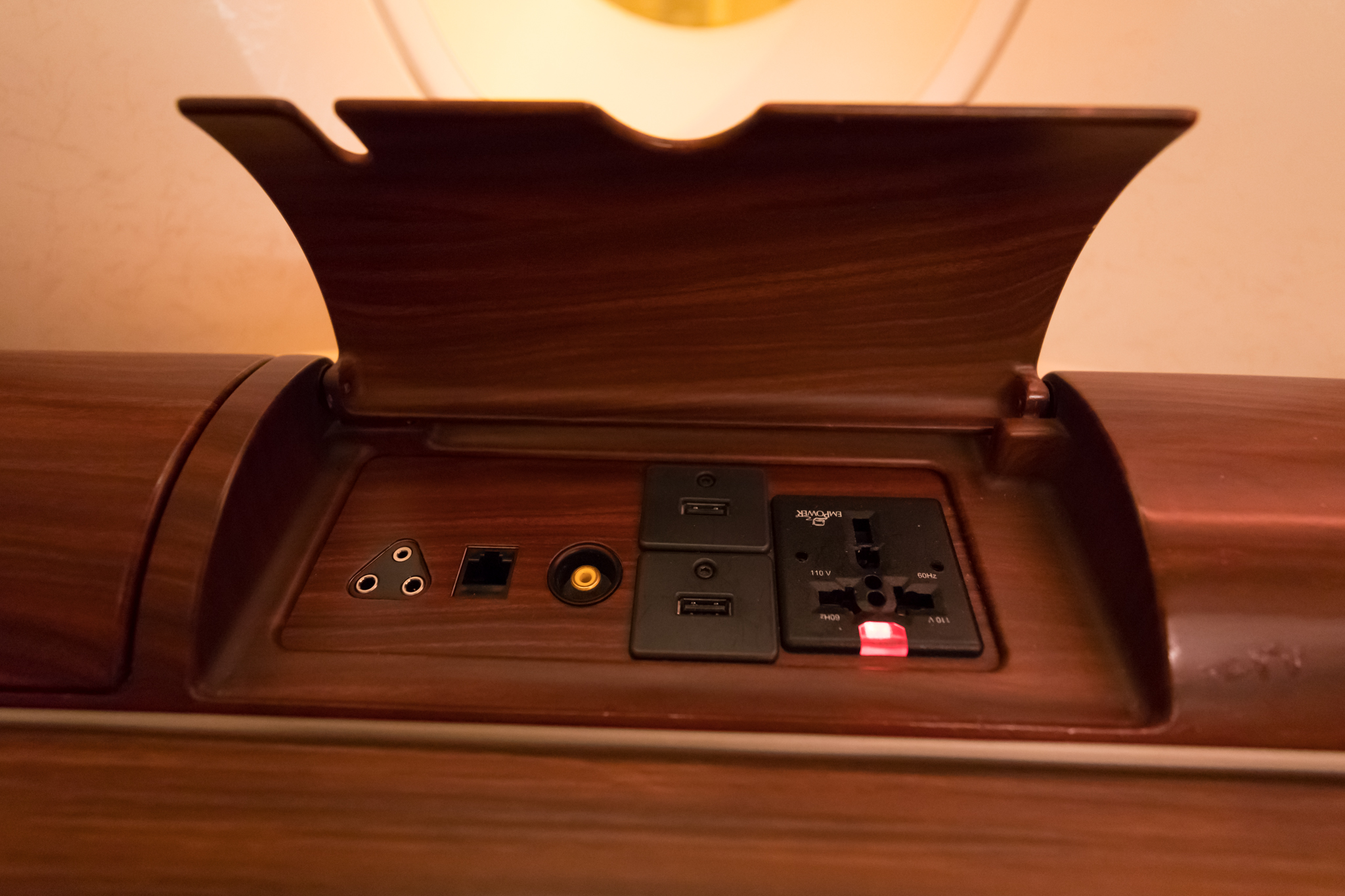 a wood box with a plug in and ports