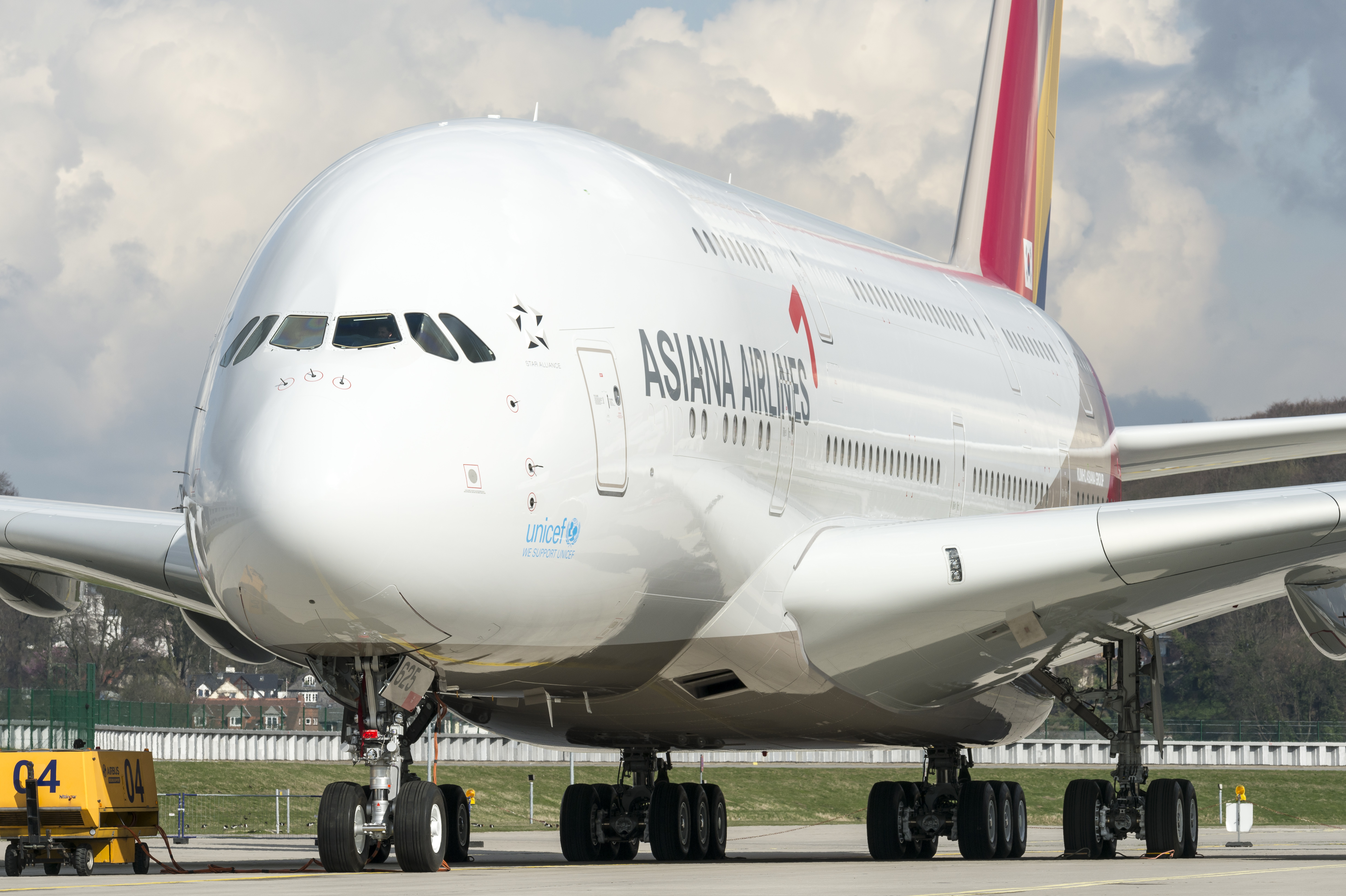 a large white airplane on a runway