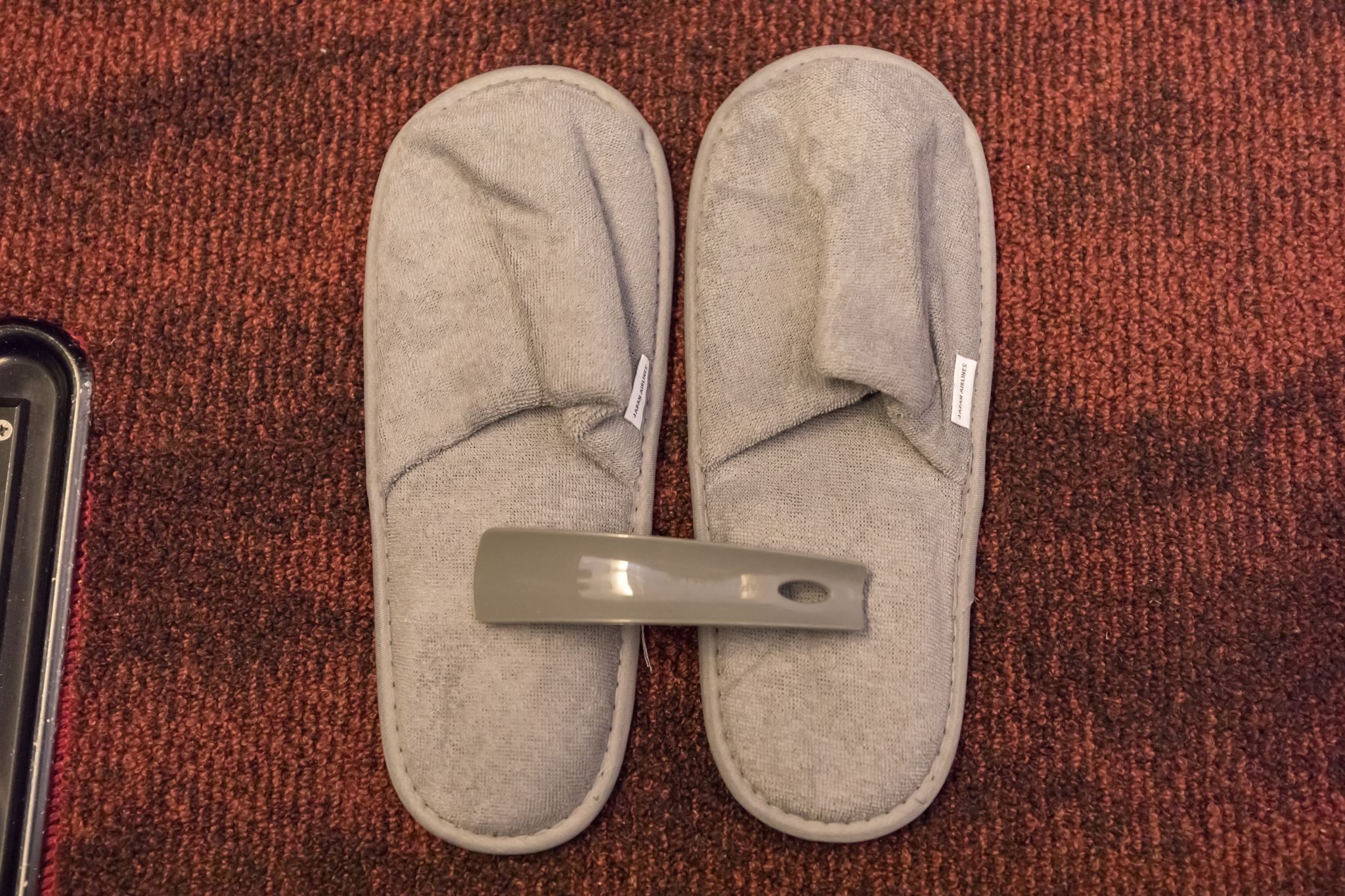 a pair of slippers on a carpet