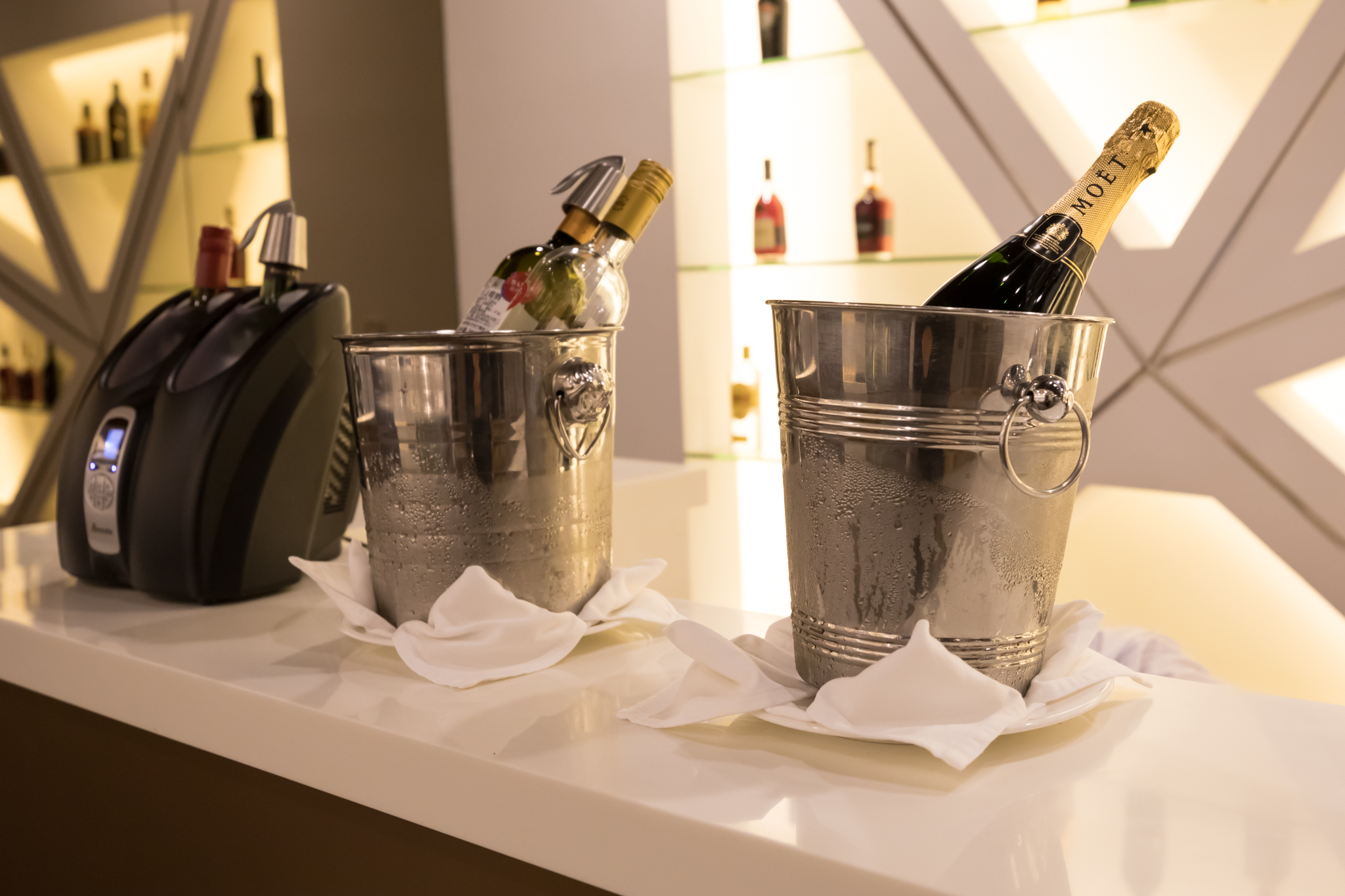 two buckets of champagne on a counter
