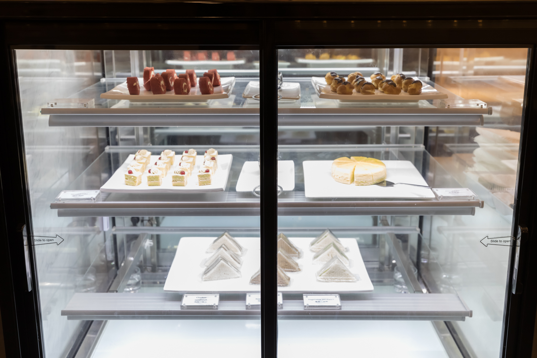 a display case with different types of desserts