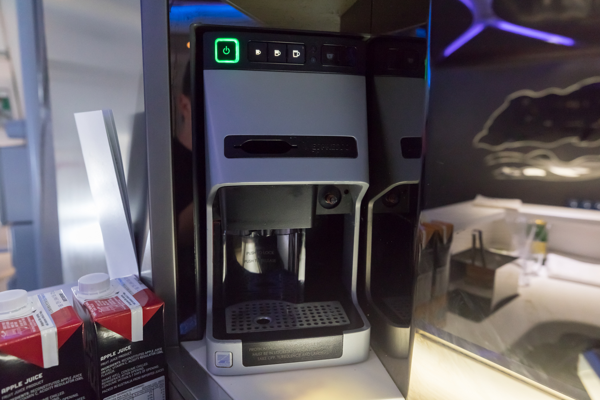 a coffee machine with a green light