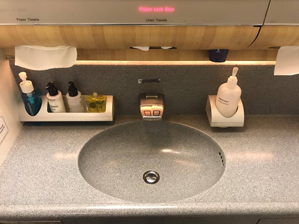 a sink with soap and soap dispensers