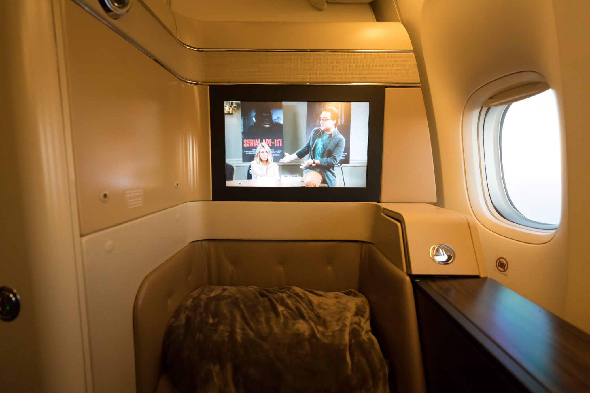 a tv on the wall of an airplane