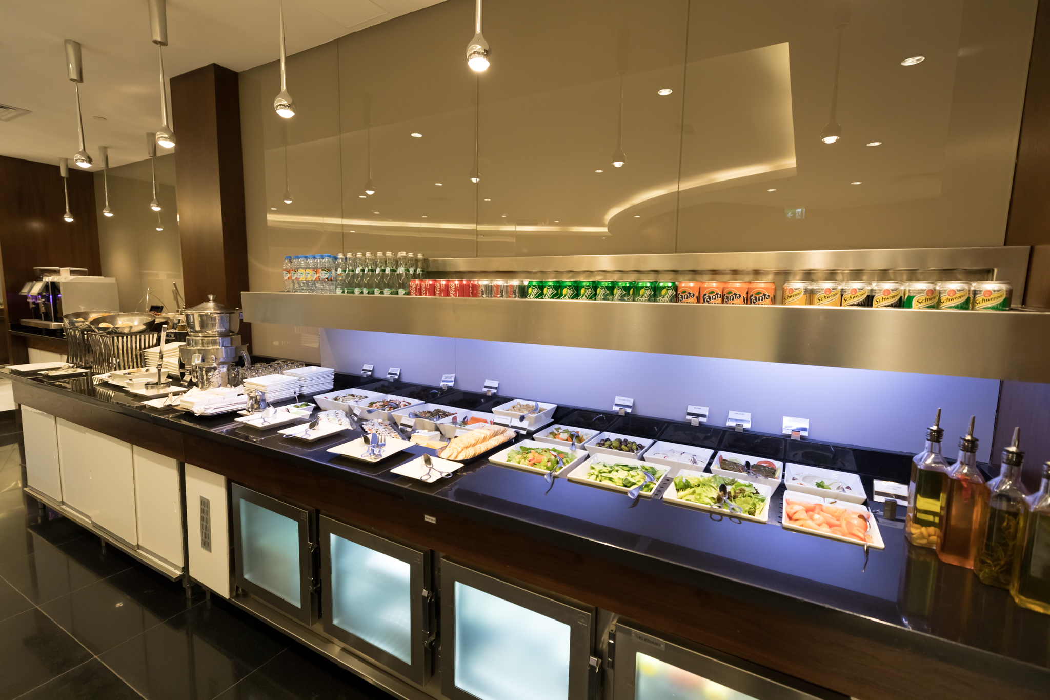 a food buffet with a variety of food items on the counter