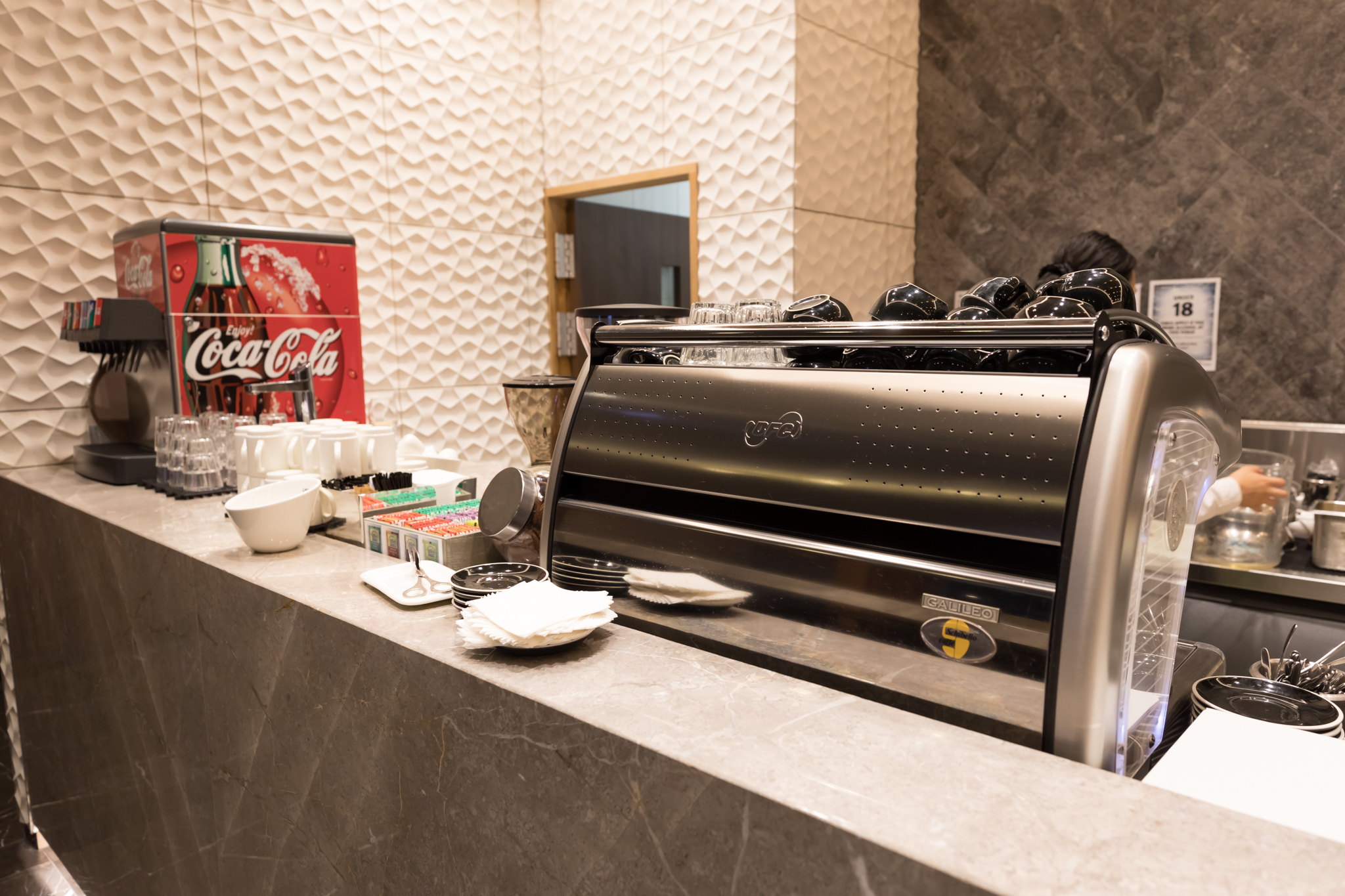 a counter with a coffee machine