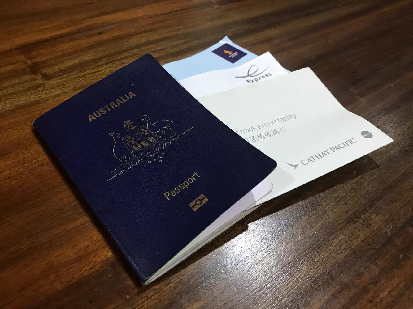 a passport and envelopes on a table