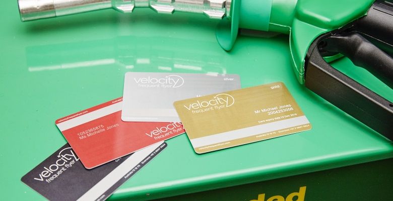 several credit cards on a green container