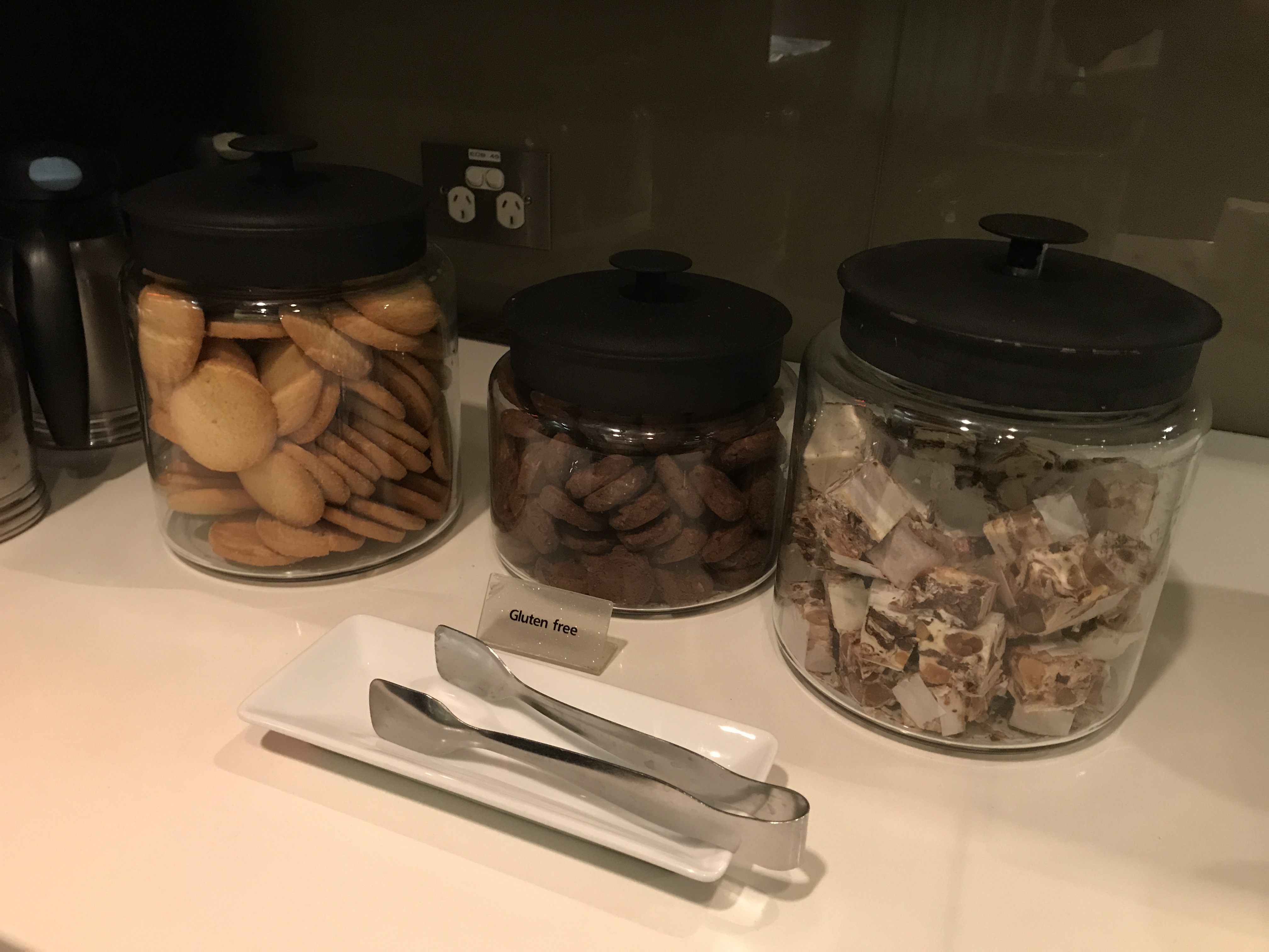 a group of jars of cookies and candy