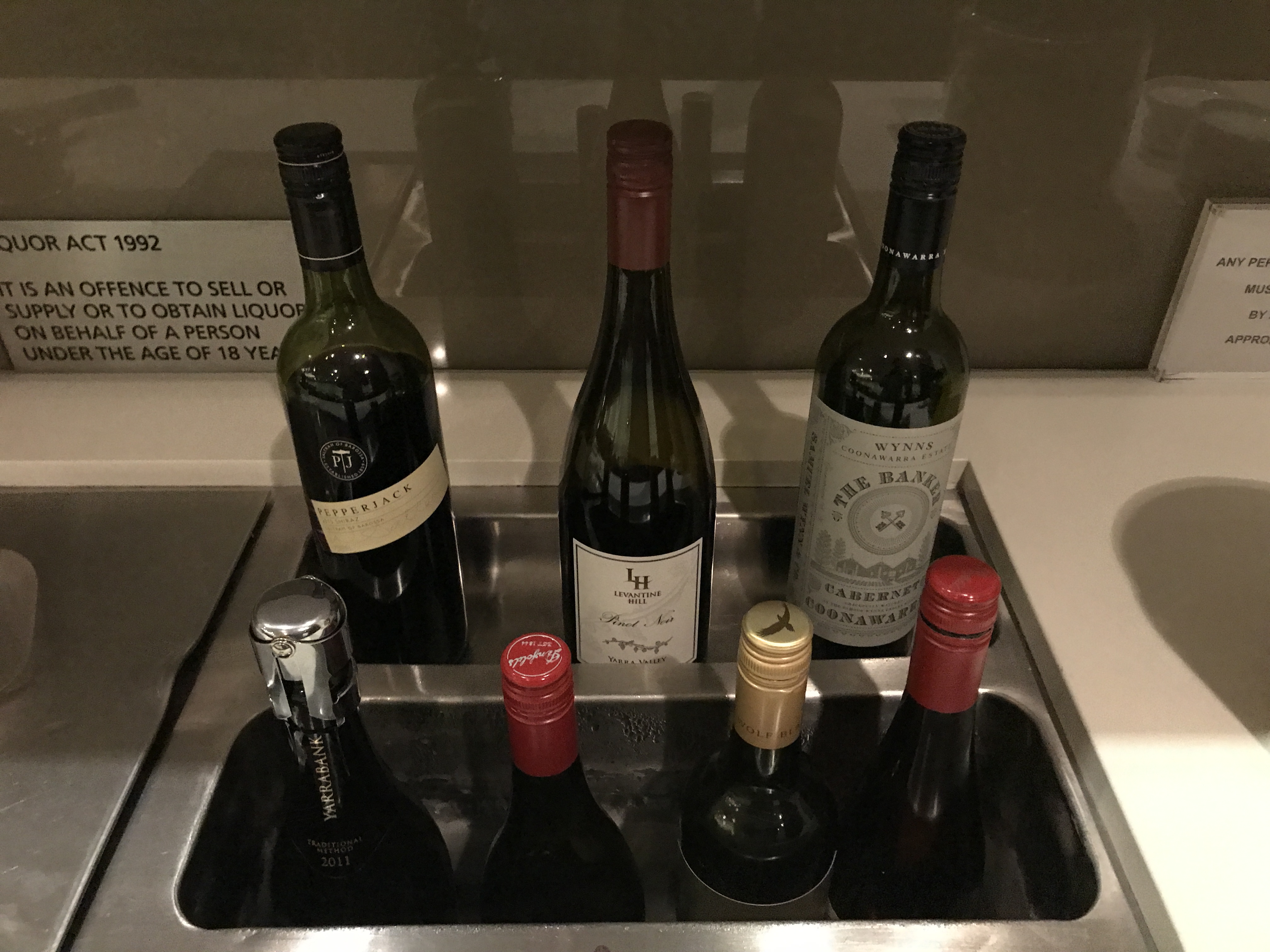 a group of bottles in a sink
