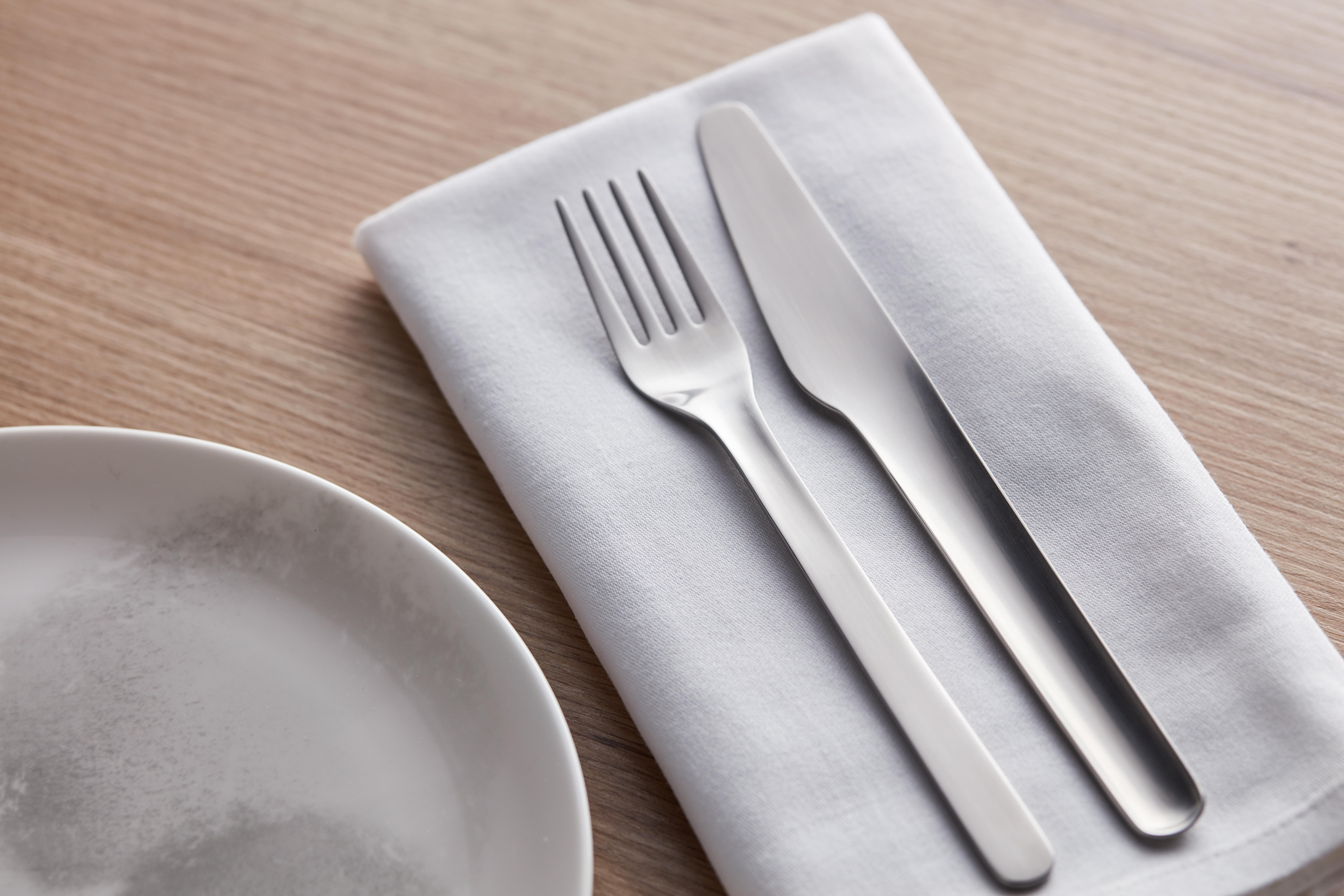 a fork and knife on a napkin