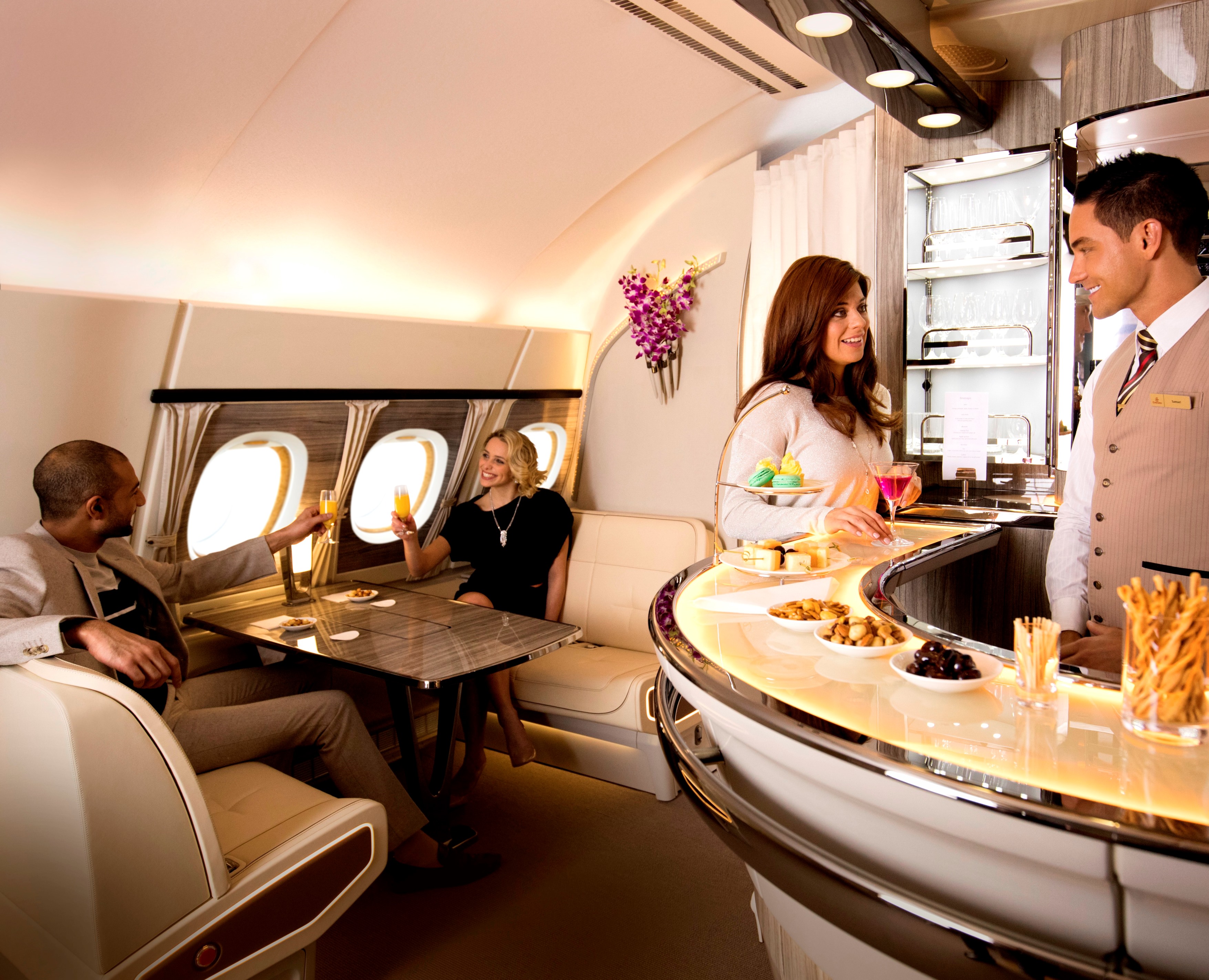 people in an airplane with a bar and people sitting at tables