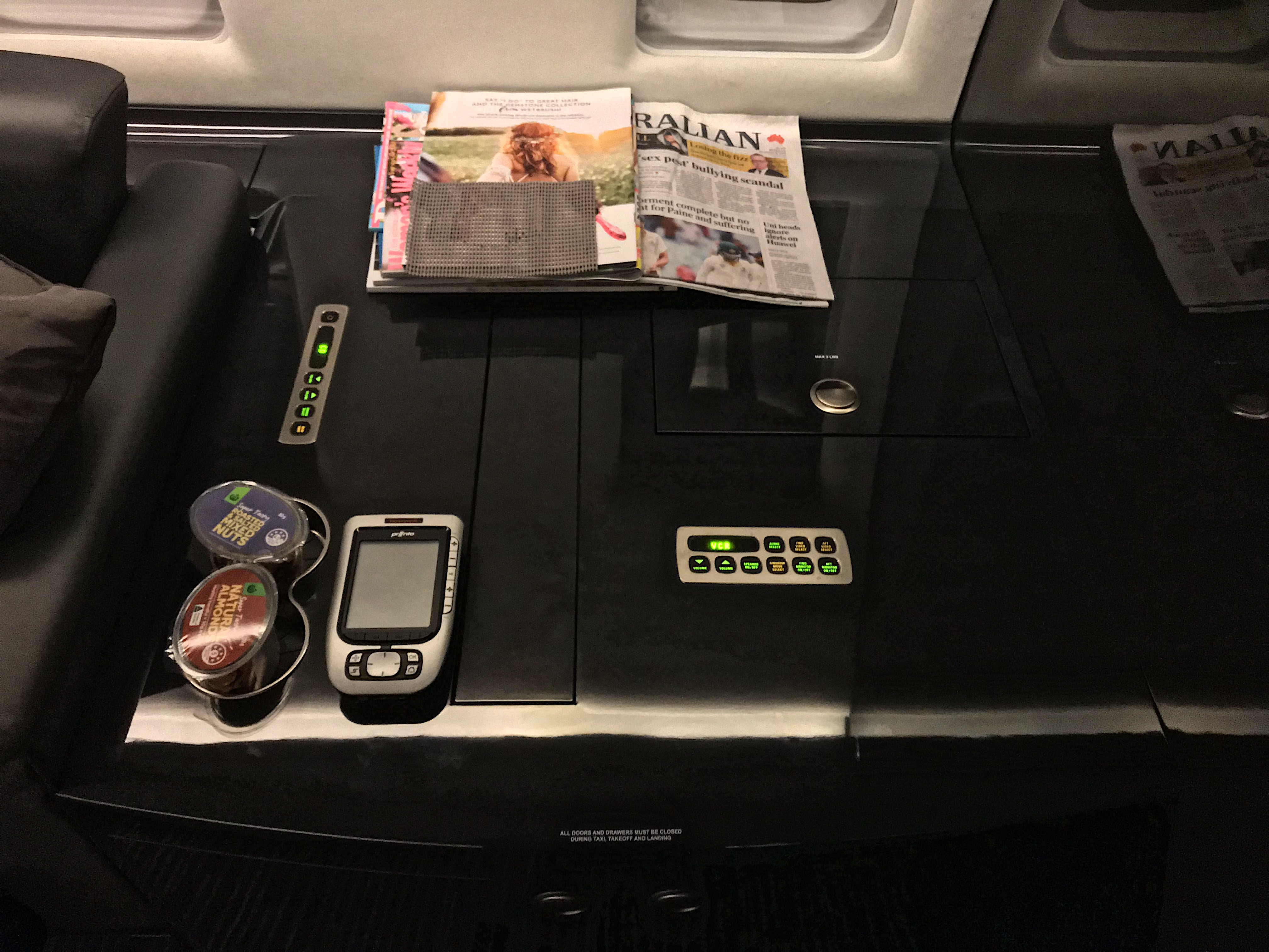 a table with a phone and magazine on it